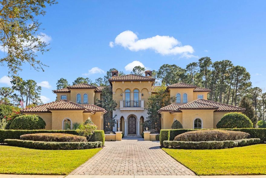 Windermere at its finest - elegantly appointed lakefront estate on the Butler chain in the gated country club community of Keene’s Pointe. Casa del Lago is a South-facing McNally custom home that has been expertly designed to allow the abundant natural light to accentuate its magnificent interior details while still offering privacy and astounding wooded and lake views over its almost 3-acre manicured grounds. Allow us to guide you through this lovely residence. 
Arrival: a stately driveway leads to twin motor courts and garage parking for 4 cars and a golf cart. 
Entry:  a solid wood 10-foot portico door welcomes you into an elegant travertine-tiled central two-story gathering area with clerestory windows overlooking the pool and lake and a tall stone fireplace; acoustics from the open circular music lounge above, also with lake views, allows this space to be grand while still intimate. 
Living: the East wing of the home opens into an expansive double island kitchen with custom wood cabinetry that masterfully houses the Wolf, Subzero and Miele appliances and the hammered copper farmhouse sink; the social heart of the home, it is accompanied by a pull-up kitchen bar and a delightful round breakfast nook with serving bar; it is adjoined on one side by the grand formal dining room (with walled courtyard) and flanked on the other by a cozy family room, all accented richly with hand-finished wood beams and woodworking details. Entertaining: leading off from the family room is the games room, ready for a full size pool table and card table and with its own pull-up bar, wine and beverage storage area, ice maker and separate media center; French doors open to the covered outdoor kitchen, dining and bar area with outdoor fireplace for the cooler nights and the large free-form pool, spa and deck; a 700-foot boardwalk leads to the lake where there is a dock with electric lifts for two jet skis and a boat, ready to explore the Butler chain of 13 lakes. 
Resting: the West wing is home to the elegant primary suite with indoor and outdoor sitting areas and dual luxurious bathrooms enjoined by a spacious dressing room with central island; there is one additional ensuite bedroom on the first floor and three more suites on the second floor which can be reached by stairs or the private elevator. 
Working/Studying: a large private office with walled flower-filled courtyard is located in the West Wing and there is a second office/homework room/hobby room on the second floor. 
Club Access: Keene’s Pointe is home to the Golden Bear Club whose members enjoy access to the 18- hole Jack Nicklaus golf course as well as restaurants, bar, tennis, club pool, fitness center and a full agenda of year-round family-friendly activities and events. 
All of this just minutes away from the charm of downtown Windermere and easy access to downtown Orlando’s best sporting and cultural events and the Orlando International Airport. Should you wish to expand the home or have more privacy, the vacant lot next door is also available (listed and priced separately). Your Casa del Lago awaits!