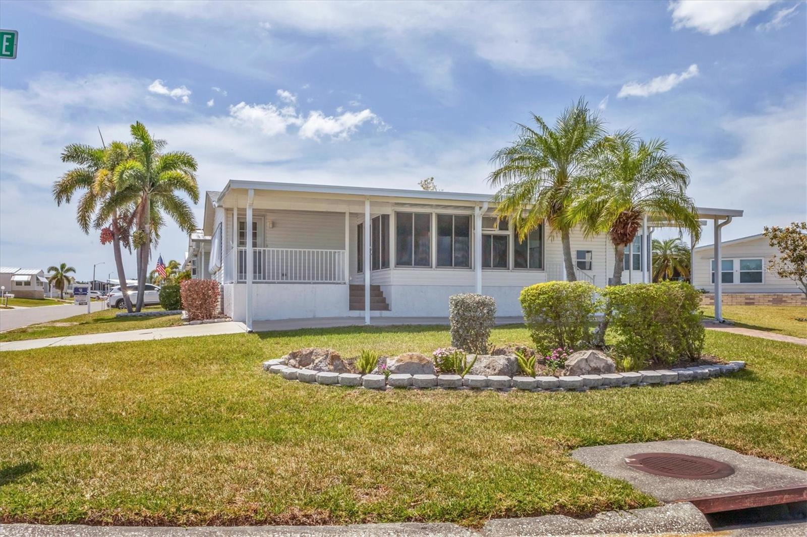 Welcome to Tidevue Estates, a land-owned 55+ community! This rarely available corner lot home, built in 2001, is tastefully turn-key furnished and ready for you to move in. The property features a brand new shingle roof (2025) and new roofs over the carport and lanai (2025). Enjoy the Florida weather on the open front porch off the lanai, which features ceramic tile flooring, glass windows, and a window air conditioning unit. The spacious living room and dining room are perfect for entertaining, with carpet/laminate flooring, vaulted ceilings, and ceiling fans throughout. The home is finished with drywall and panel doors for a modern touch. The kitchen is a cook's dream, featuring laminate flooring, countertops resembling granite with a mitered edge, white cabinetry, a large pantry, and a desk area with storage. The inside laundry closet adds convenience. The den/office can serve as extra space for guests. Retreat to the primary bedroom with an en-suite bathroom that includes dual sinks, a walk-in shower, and a tubular skylight for added brightness. A large shed in the back provides ample storage or the perfect workshop. This home also includes a 2-car carport with a paver sidewalk leading to the side entrance. Don't miss out on this exceptional property in Tidevue Estates! Low HOA of only $600 annually. Pets are not permitted. Plenty of activities to keep you busy in this community. Take a water aerobics class in the solar-heated community pool, or work on your tan. The community library has free WI-FI connection. Updated fitness center. Meet friends and make new ones for a game of indoor pickle ball, bocce ball, or shuffleboard. Join the Golf League. Take a bike or golf cart ride to Veterans Park to watch the wildlife and enjoy the sunset. Ellenton Premium Outlet Mall, restaurants, and medical facility's just minutes away. Easy access to I-75. Explore Sarasota and visit University Town Center Mall, St. Armand's Circle, Selby Botanical Gardens, and the Ringling Mansion & Museum. Not to mention a short drive to our beautiful Gulf Beaches.