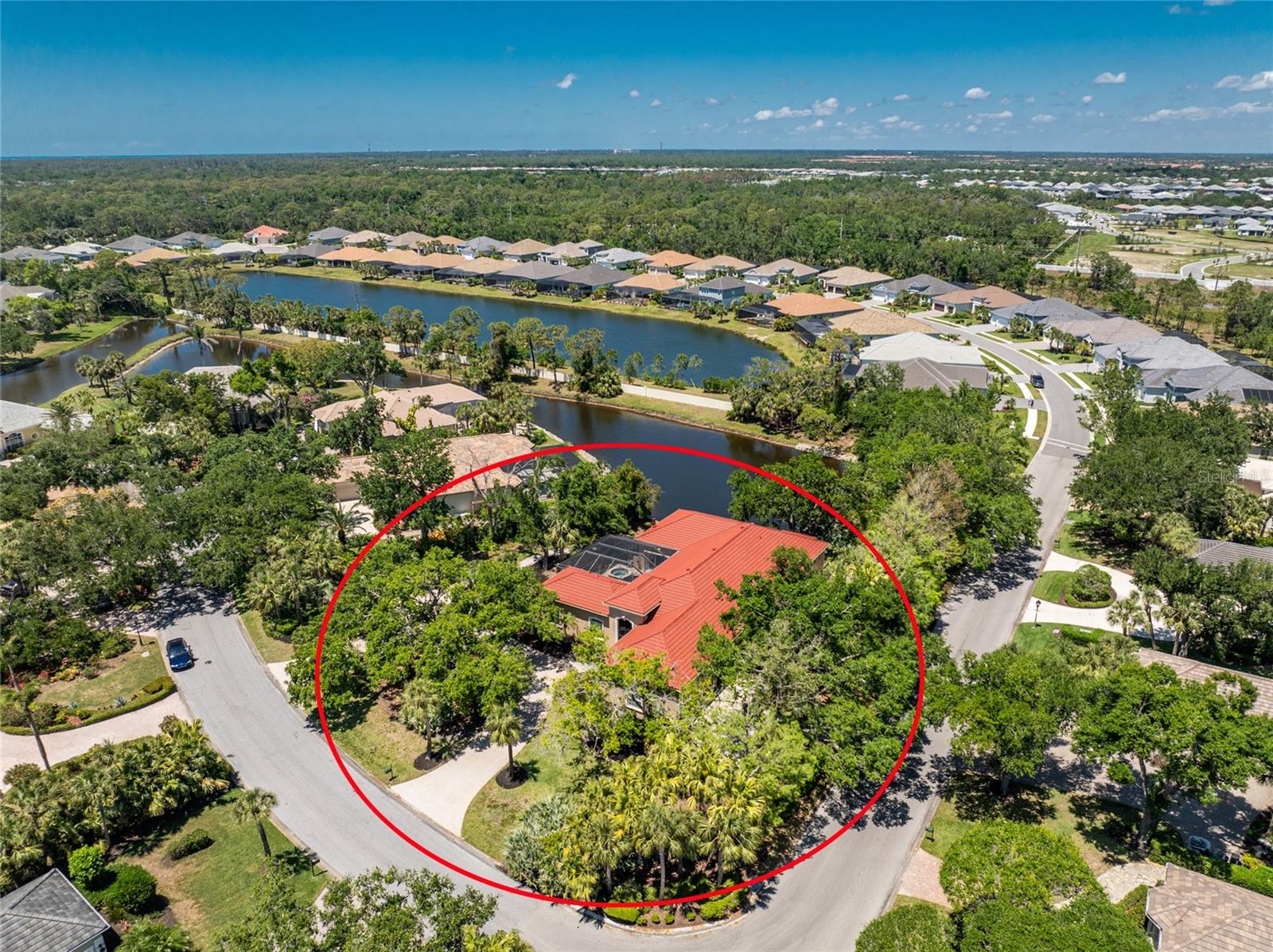 Timeless luxury and grand-scale Southern living come together in Boca Royale Golf & Country Club, where you can step back into the charm of Old Florida and watch Spanish moss-draped oak trees sway in the gentle breeze. Come and experience a resort-style lifestyle in one of the area’s most exclusive gated communities. This custom-built, courtyard-style private pool home offers exceptional privacy and features three bedrooms (including a separate casita), three full baths, and an oversized side entry two-car garage with a dedicated golf cart bay. Situated on a double corner lakefront lot in the X flood zone, the home is being sold turnkey-furnished. A circular driveway and grand, gated entrance leads to a covered courtyard area and welcomes you into a home filled with refined elegance, featuring soaring ceilings and custom wood built-ins throughout. The spacious main living area includes a combination living and dining room, a kitchen and great room with rich cabinetry, granite countertops, an island with bar seating, a separate wet bar, and an abundance of storage, all designed with both comfort and entertaining in mind. A four-season sunroom offers unparalleled views of the tranquil lake and is the perfect spot for your morning coffee or an afternoon with a good book. The expansive master suite has tray ceilings, a built-in desk, sliding doors opening to the sunroom, and a luxurious ensuite bath with an oval garden tub, oversized custom walk-in shower, dual granite-topped vanities, a dedicated makeup area, and a huge custom walk-in closet. A second ensuite bedroom in the main home adds flexibility, while the casita serves as a fully equipped retreat for providing the ultimate privacy to visiting family and friends with a living/dining area, bedroom, bath, and kitchenette, all opening directly onto the courtyard lanai. Outdoor living is elevated by the screen enclosed heated saltwater pool and spa, keystone paver walkways, lush tropical landscaping, and a custom seawall built on the lake. Additional highlights include a whole-house sound system controlled with your smart device, 2025 metal tile roof with stone coating, the garage includes a designated workshop space with built-in cabinetry, an electronic screen for the front gated entry allowing you to open all the doors and windows keeping the home pest free, and for hurricane protection there is a combination of rolling shutters and panels. Boca Royale offers a dynamic lifestyle with access to championship golf, tennis, pickleball, group fitness classes, resort-style amenities, and exceptional dining at the clubhouse. When you're ready to venture beyond the gates, you're just minutes from pristine Gulf beaches, waterfront tiki bars with nightly live music, public boat ramps for easy access to world-class fishing and sandbar fun, and the boutique shops and restaurants of Historic Dearborn Street. Brimming with Southern charm and set within a country club community, this exceptional property offers a gracious lifestyle both inside and out. Contact us today to schedule your private showing.