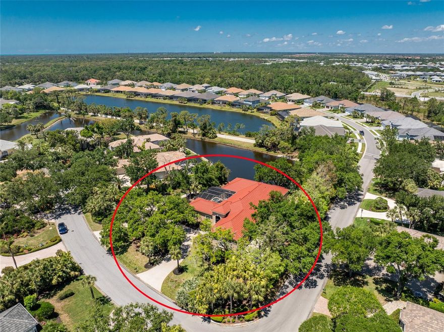 Timeless luxury and grand-scale Southern living come together in Boca Royale Golf & Country Club, where you can step back into the charm of Old Florida and watch Spanish moss-draped oak trees sway in the gentle breeze. Come and experience a resort-style lifestyle in one of the area’s most exclusive gated communities. This custom-built, courtyard-style private pool home offers exceptional privacy and features three bedrooms (including a separate casita), three full baths, and an oversized side entry two-car garage with a dedicated golf cart bay. Situated on a double corner lakefront lot in the X flood zone, the home is being sold turnkey-furnished. A circular driveway and grand, gated entrance leads to a covered courtyard area and welcomes you into a home filled with refined elegance, featuring soaring ceilings and custom wood built-ins throughout. The spacious main living area includes a combination living and dining room, a kitchen and great room with rich cabinetry, granite countertops, an island with bar seating, a separate wet bar, and an abundance of storage, all designed with both comfort and entertaining in mind. A four-season sunroom offers unparalleled views of the tranquil lake and is the perfect spot for your morning coffee or an afternoon with a good book. The expansive master suite has tray ceilings, a built-in desk, sliding doors opening to the sunroom, and a luxurious ensuite bath with an oval garden tub, oversized custom walk-in shower, dual granite-topped vanities, a dedicated makeup area, and a huge custom walk-in closet. A second ensuite bedroom in the main home adds flexibility, while the casita serves as a fully equipped retreat for providing the ultimate privacy to visiting family and friends with a living/dining area, bedroom, bath, and kitchenette, all opening directly onto the courtyard lanai. Outdoor living is elevated by the screen enclosed heated saltwater pool and spa, keystone paver walkways, lush tropical landscaping, and a custom seawall built on the lake. Additional highlights include a whole-house sound system controlled with your smart device, 2025 metal tile roof with stone coating, the garage includes a designated workshop space with built-in cabinetry, an electronic screen for the front gated entry allowing you to open all the doors and windows keeping the home pest free, and for hurricane protection there is a combination of rolling shutters and panels. Boca Royale offers a dynamic lifestyle with access to championship golf, tennis, pickleball, group fitness classes, resort-style amenities, and exceptional dining at the clubhouse. When you're ready to venture beyond the gates, you're just minutes from pristine Gulf beaches, waterfront tiki bars with nightly live music, public boat ramps for easy access to world-class fishing and sandbar fun, and the boutique shops and restaurants of Historic Dearborn Street. Brimming with Southern charm and set within a country club community, this exceptional property offers a gracious lifestyle both inside and out. Contact us today to schedule your private showing.