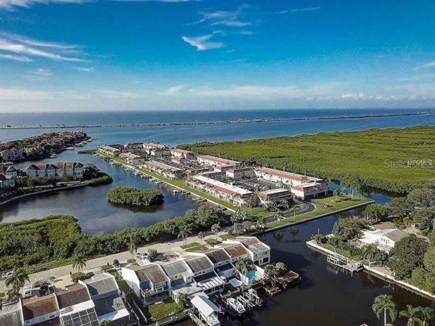 COMPLETELY RENOVATED DOWNSTAIRS, 2 BEDROOM, ONE & A HALF BATH, WATERFRONT CONDO FOR SALE. ALL NEW APPLIANCES, NEW FLOORING & PAINT, NEW A/C, NEW ELECTRIC WATER HEATER, ALL NEW BATHROOM WITH TILED WALK IN SHOWER. WASHER AND DRYER HOOK UP. THIS UNIT ALSO FEATURES A SCREENED IN PATIO OVERLOOKING THE INTRACOASTAL WATERWAY. THE UNIT COMES WITH AN ASSIGNED BOAT DOCK AND ONE ASSIGNED PARKING SPACE. FROM BAY POINTE, YOU CAN ACCESS THE WATERWAYS FROM TAMPA BAY ALL THE WAY TO THE SKYWAY BRIDGE AND BEYOND, THERE ARE NO FIXED BRIDGES. THE HOA INCLUDES WATER & TRASH PICK UP, TENNIS/BASKETBALL/PICKLEBALL COURT, HEATED POOL, FLOOD INSURANCE ON THE BUILDING AND ESCROW RESERVES. THERE'S ALSO A CLUBHOUSE AND FULL LAUNDRY ROOM ON SITE. VACANT AND EASY TO SHOW.