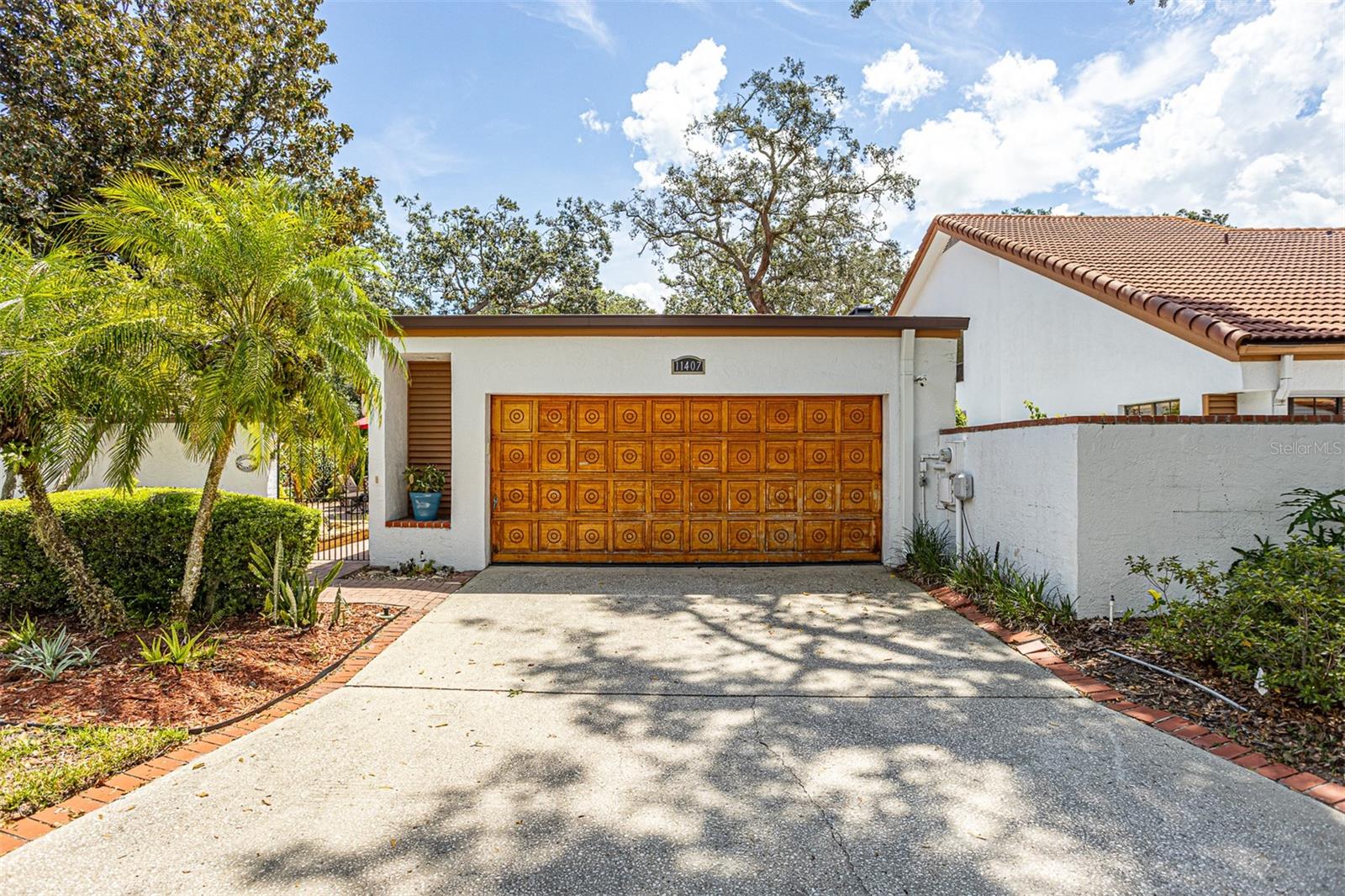 Fall in LOVE with this beautiful maintained 2 bedroom, 2 bathroom home with WATER ACCESS in Temple Terrace! This stunning unit welcomes you with a brick courtyard and soothing sounds of a tranquil water fountain. Step inside to discover a thoughtfully designed interior featuring granite counter tops in the kitchen, a double sided fireplace, and an abundance of natural light. The primary suite offers a luxurious en-suite bathroom complete with spa like walk-in shower and relaxing soak tub - perfect for unwinding. Both bedrooms offer direct access to a serene, private patio courtyard surrounded by lush landscaping. This community is on the RIVER. It includes a 7 acre park that’s GATED for its residents ONLY. Enjoy the POOL, GAZEBO on the river, walking TRAILS, and TENNIS courts. This home is located close to the Temple Terrace Golf and Country Club, enjoy easy access to highway I-75, USF, and plenty of restaurants and shopping. This home you won’t want to miss! Reach out for your private showing today.