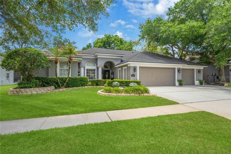 Tucked away within the exclusive gated enclave of Bloomingdale’s Cambridge Cove, this beautifully maintained 4-bedroom, 3-bathroom, 3-car garage POOL home is loaded with EVERY extra option on your list.  As you enter the neighborhood through the private gate, you will immediately notice the impeccable curb appeal of each of the private estates.  Mature landscaping and classic oak trees make an impressive first impression from the moment you arrive. Perfectly manicured grass and an executive driveway welcome you home.   Inside, you’ll find spacious formal living and dining areas accented with hardwood flooring, crown molding, architectural niches, and abundant natural light, all overlooking the sparkling pool and lanai. The family room is generously appointed with built-in custom cabinetry, volume ceilings and windows, and Bose speakers, creating an inviting space for both everyday living and entertaining.  The heart of the home is the spacious kitchen featuring stainless steel appliances, a center island, breakfast bar seating, a large pantry, and a sunny eat-in dining area with beautiful views of the outdoor living space. The oversized master suite is a true retreat, complete with a sitting area, private access to the lanai, and four closets including two walk-ins. The en-suite bathroom features dual vanities, a relaxing soaking tub, separate shower, and ample storage space.  A dedicated office, bonus room loft, and 3-car garage offer the perfect blend of elegance, comfort, and functionality . The private office with French doors creates the ideal work-from-home space or quiet retreat and exudes luxury with custom its built-in desk, office cabinetry ,and a Liberty safe. Designed with privacy in mind, the thoughtful three-way split bedroom layout offers comfort for both homeowners and guests alike. Two secondary bedrooms share a convenient Jack-and-Jill bathroom, while the fourth bedroom is positioned near a full bath that also serves as a pool bath. Upstairs, the large bonus room provides endless possibilities and is perfect for a media room, game room, studio or playroom, or guest suite... the possibilities are endless. Step outside to your private Florida oasis featuring a fully screened IN-GROUND POOL and HEATED SPA surrounded by lush landscaping, a covered lanai, and plenty of room to relax or entertain year-round. The lanai is equipped with speakers and a TV enhancing the outdoor living experience.  Summertime barbecues, family gatherings, and quiet evenings alike will all be enjoyed in your amazing outdoor space.  You will be the envy of all your guests when they get a peek of your OVERSIZED THREE-CAR garage.  Featuring built-in storage and over 900 SQ FT of space, this is the perfect place for your cars, projects, tools, gym, and more! Additional outdoor features include a Ring doorbell system, garage refrigerator, and workbenches that provide excellent utility space for hobbies or storage. Located within the sought-after Bloomingdale golf community, residents enjoy miles of sidewalks for walking, jogging, and biking, along with nearby parks, recreation facilities, shopping, dining, and TOP RATED schools. This exceptional Valrico home truly offers the best of Florida living.  Don't miss your chance to own one of the finest homes in the area!
