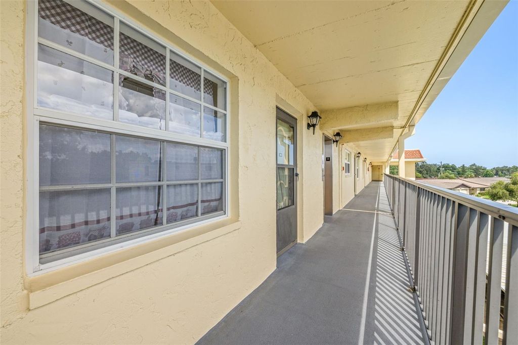 Photo of 1450 Heather Ridge Boulevard #305, Dunedin, FL 34698 (MLS # TB8411350)