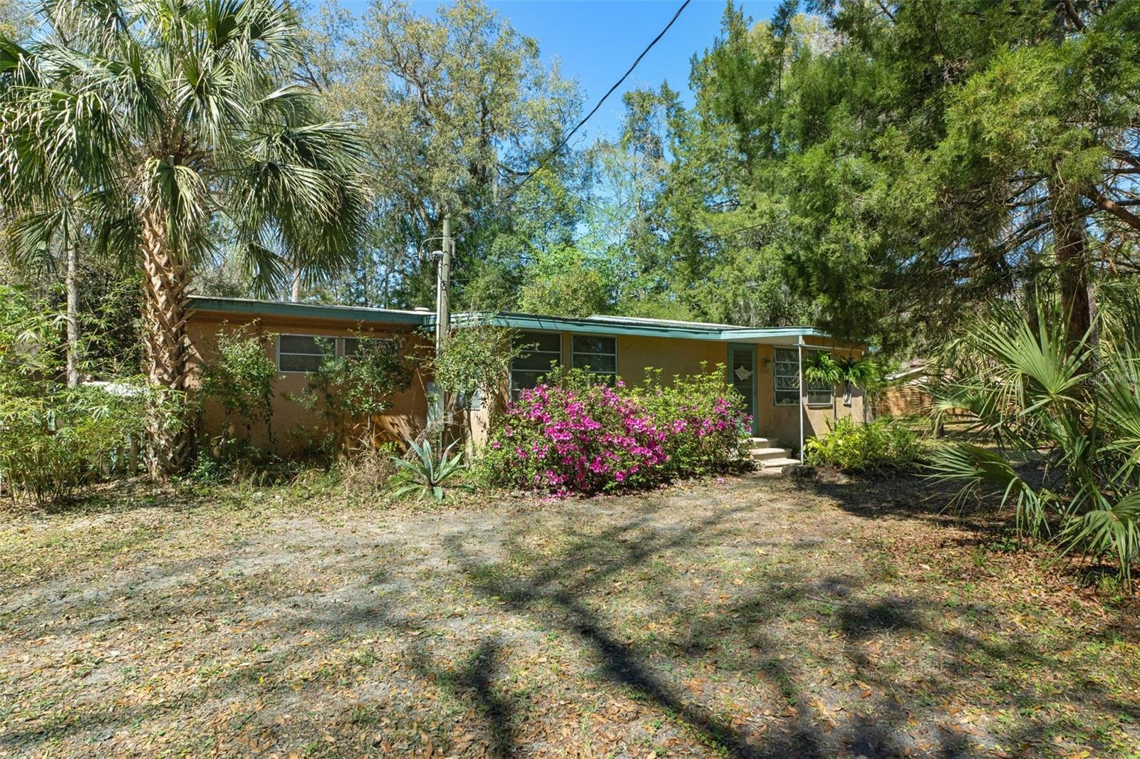 harming Hideaway on ½ Acre Next to the Chassahowitzka Wildlife Refuge! Tucked away in a peaceful setting, this adorable cute home is full of personality and charm! Sitting on ½ acre of lush land, this cozy retreat is surrounded by towering trees, offering privacy and a connection to nature. Inside, you’ll find light and bright, inviting spaces with unique character, from charming spaces to rustic touches that make it feel like home. Enjoy your mornings on the covered screened porch, listening to the birds sing, or sit by the firepit and enjoy the nature. With plenty of space for gardening, outdoor entertaining, or just relaxing under the stars, this home is a true hidden gem for nature lovers. Don’t miss this one-of-a-kind retreat!