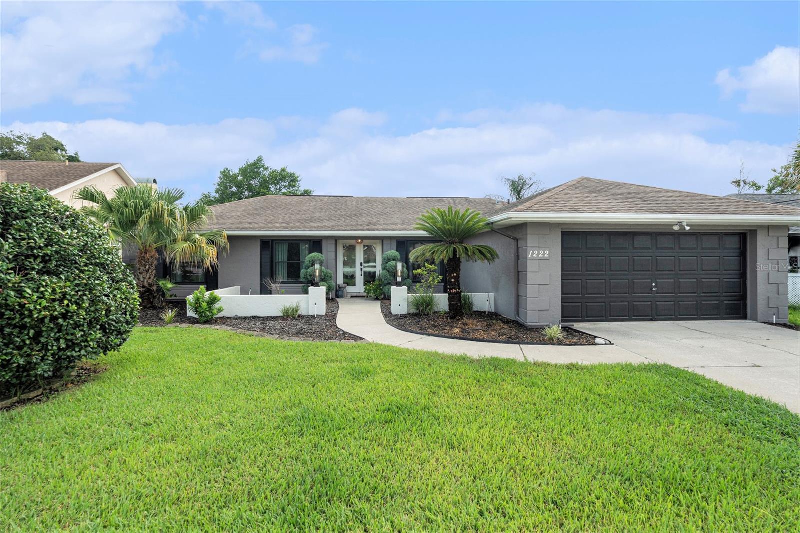 Modern Charm Meets Relaxed Florida Living in Seven Hills
Welcome to this stylishly updated 2-bedroom, 2-bathroom pool home, perfectly situated in the sought-after Seven Hills community. From the moment you step inside, you’re greeted by a calming color palette of soft blues, grays, and whites that create a serene and inviting atmosphere. Natural light pours into the spacious living area with soaring vaulted ceilings , offering unobstructed views of the sparkling Salt water private pool with a rock waterfall—your own personal oasis.The beautifully designed kitchen is a true showstopper, featuring shaker-style cabinetry in complementary tones, solid surface countertops, a sleek subway tile backsplash, stainless steel appliances, and industrial-inspired lighting that adds just the right touch of character. A custom-painted barn door provides a stylish and functional separation between the guest suite and main living areas, offering privacy for visitors or a peaceful home office setup. The spacious primary suite is thoughtfully positioned near the indoor laundry and includes a fully renovated ensuite with a double vanity, a walk-in shower, and a generous walk-in closet with built in features.
For fitness enthusiasts, this home offers the best of both worlds—a private pool ideal for swimming laps and access to community sidewalks perfect for morning jogs or evening strolls. Plus, you’re just a short distance from the Hernando County YMCA across the main street from the community.