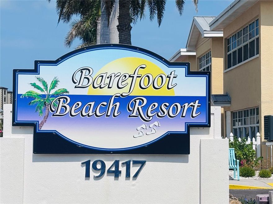 Experience resort-style living on five acres of waterfront property at Barefoot Beach Resort.  This unique setting offers a peaceful, tropical oasis with native landscaping, a relaxed
coastal ambiance, and easy access to some of Florida’s most beautiful beaches.
Unit B-209 is a desirable corner unit located on the 2nd floor, perfectly positioned to provide added privacy while still offering tranquil views from your front door—without the premium waterfront price. Located on the second floor for added peace
of mind, this fully furnished 2-bedroom, 1-bath condo comfortably sleeps 6 with a sleeper sofa.
This condo features a spacious and functional layout with a full-size kitchen, living and dining areas, a primary bedroom, and a
bonus sun room—perfect for relaxing after a day at the beach.  Step outside and enjoy everything this waterfront community has to offer. The heated pool and patio area—just a short walk from your door—feature ample lounge seating for soaking up the
sun. Multiple grilling stations provide the perfect setting for outdoor dining, while the fishing
dock, equipped with electricity and water, allows you to catch and prepare your own fresh
seafood. Boat slips are also available for separate purchase, making this an ideal spot for boating
enthusiasts. Whether you’re seeking a full-time residence, vacation getaway, or income-producing property,
this condo offers exceptional flexibility. It is sold fully furnished and turnkey, with a strong rental
history and onsite rental management available—allowing you to generate income without the
hassle of day-to-day oversight.
Barefoot Beach Resort is located in the charming coastal beach town, known for
its laid-back atmosphere and small-town feel, yet conveniently close to Clearwater Beach, St.
Pete Beach, and Tampa. From boating and fishing to beach days and sunset strolls, this location
offers the perfect blend of relaxation and recreation.