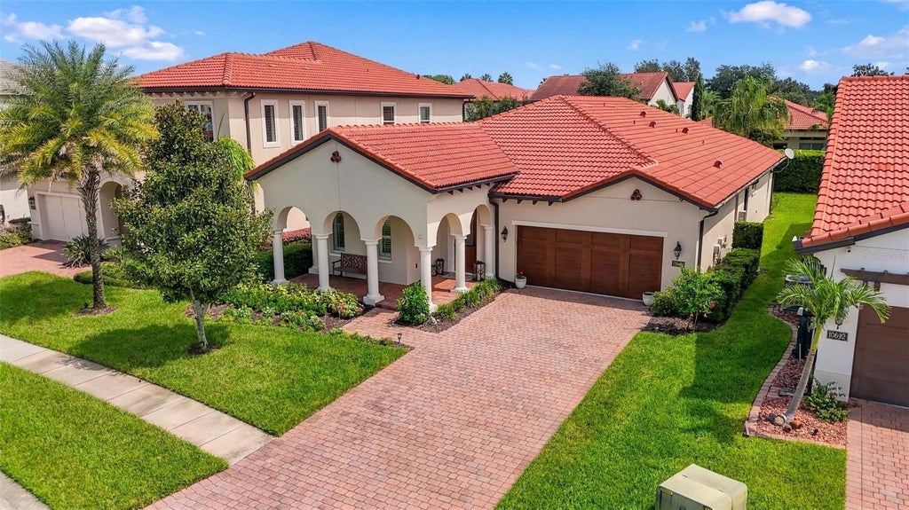 Photo of 10698 Royal Cypress Way, Orlando, FL 32836 (MLS # O6443682)