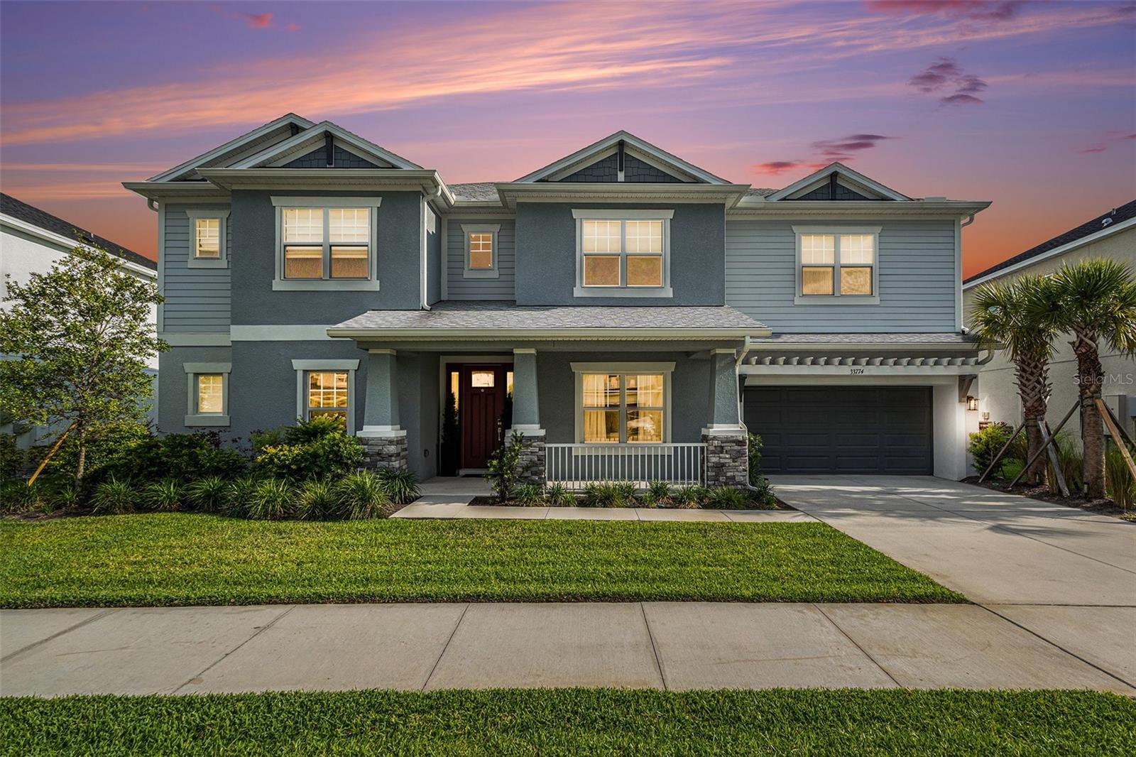 Luxury Meets Lifestyle in This 2023 EXCLUSIVE BIMINI Masterpiece! Step into sophistication with this stunning 5-bedroom, 4.5-bath, 3 CAR GARAGE home, offering 4,271 sq ft of impeccably designed living space in the highly sought after River Landing community of Wesley Chapel. Crafted with exceptional attention to detail and premium finishes, this home boasts: Soaring ceilings and open-concept living spaces, a custom POOL with breathtaking pond and conservation views, an expansive covered PANORAMIC lanai with a fully equipped outdoor kitchen and built-in grill that is perfect for entertaining, a chef’s gourmet kitchen featuring quartz countertops, DUAL oversized islands, gas cooktop, double ovens, and a butler’s pantry. The main level primary suite offers a peaceful retreat with stunning water views, a spa-like ensuite bath with large walk-in shower, soaking tub, dual vanities, and his-and-hers walk-in closets. A spacious laundry room is conveniently located near the kitchen, and a pool bath provides easy access from the outdoor area. Upstairs, you’ll find a second primary suite with a private bath, ideal for guests or multigenerational living, as well as a loft, a media room, and three additional bedrooms, offering space and comfort for the whole family. Located just minutes from top rated schools, premium shopping, outlet mall, dining, and major highways, River Landing also offers LUXURIOUS RESORT-style amenities including tennis courts, pickleball, a clubhouse, dog park, playground, outdoor exercise equipment, trails and a luxurious pool. This home is the one you've been waiting for. Schedule your private tour today!