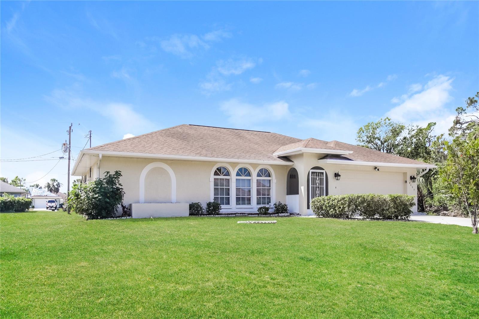LOCATION, LOCATION, LOCATION! This CITY WATER home is perfectly situated in the heart of North Port, Florida, just moments from Coco Plum Plaza—yet nestled in a quiet, friendly neighborhood. Step inside to an open floor plan featuring cathedral ceilings, a spacious living room, dining area, and family room, along with split bedrooms for added privacy. The master suite boasts a large walk-in closet and a luxurious bathroom with a Roman-style shower. The guest quarters include a well-appointed bathroom that can also serve as a convenient lanai/pool bath. Step out to the screened lanai—generously sized and complete with a hot tub, overlooking a beautiful backyard with ample space to add a future pool. This property is free of HOA and CDD fees, and close to Gulf beaches, the new water park, shopping, dining, schools, and major highways. Make this your piece of Florida paradise today!