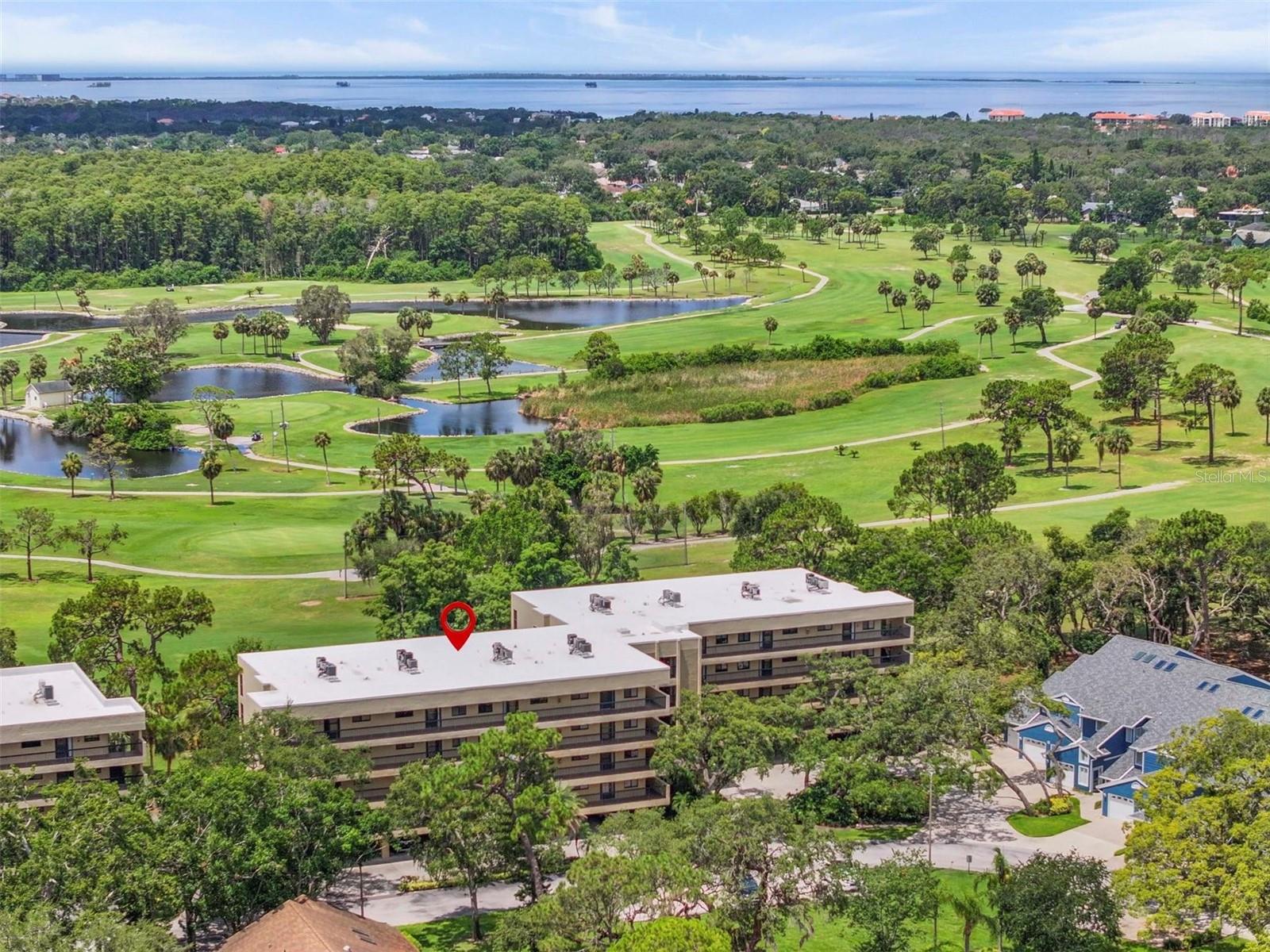 Now available for rent in the desirable 55+ community of Green Dolphin, this beautifully furnished two-bedroom, two-bath top-floor unit delivers sweeping panoramic views of the golf course, serene pond, community pool, and unforgettable Florida sunsets. Located in the heart of Tarpon Springs, this bright and inviting condo stands out with its open layout, tasteful updates, and unmatched privacy with retractable shades in the Florida room.
Step into the welcoming foyer and take in the spacious living and dining areas, filled with natural light and complemented by warm laminate wood flooring throughout. To the right, the updated eat-in kitchen features granite countertops, a brand-new stainless steel refrigerator (2024), stainless steel appliances, a breakfast bar, pantry, and a charming nook for morning coffee. The kitchen seamlessly flows into the main living space, where you’ll find two comfortable sofas, a full-size dining table, and direct access to the enclosed lanai through sliding glass doors.
The oversized master suite, tucked just off the living area, includes a walk-in closet, an ensuite bath with a double sink vanity, a linen closet, and additional storage. Sliding doors from the master also open onto the lanai, where floor-to-ceiling windows and sunshades offer the option to soak in the views or relax in the breeze. The second bedroom is thoughtfully positioned near the front of the unit for added privacy and is adjacent to the second full bath, which includes an updated vanity, walk-in shower, and a laundry area with full-size washer and dryer.
Throughout the unit, thoughtful finishes like luxury vinyl tile in the kitchen and foyer add durability and style. A reserved, under-building covered parking spot and a separate storage unit provide extra convenience for seasonal gear, bikes, or golf clubs. The condo also includes a utility closet for added flexibility.
The Green Dolphin community offers a lively, active lifestyle with a wide range of amenities including a heated pool, tennis courts, fitness center, BBQ area, clubhouse, and social activities. Rent includes cable, internet, water, sewer, and trash.
Just minutes from the world-famous Tarpon Springs Sponge Docks, beaches, shopping, restaurants, and the Pinellas Trail, and directly across the street from a hospital and medical offices, this location is ideal for those seeking both comfort and convenience. Golfers will appreciate the proximity to Tarpon Springs Golf Course, Innisbrook’s Copperhead Course, and several other nearby options. With its unbeatable views, updated features, and ideal setting, this fully furnished unit offers the perfect Florida rental experience.