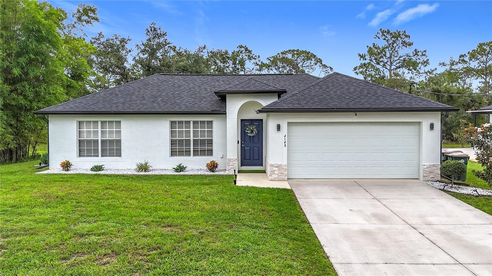 ***GREAT LOCATION***LOTS OF UPDATES***This well-maintained Single Family Home offers 3 bedrooms, 2 baths, open floor plan with split bedrooms, family room and a formal dining room! Cathedral ceilings in common areas and master bedroom amplifies the spaciousness of the home. Recent updates include: NEW ROOF (less than 2 years old, end of 2023), Updated HVAC SYSTEM (end of 2023), WATER HEATER TANK (2022), SEPTIC TANK (2020), WELL WATER FILTRATION SYSTEM (2023), Remodeled Kitchen (2020-2021), fully remodeled master bathroom, new tile floors throughout common areas and bathrooms and laminate in the bedrooms. Kitchen offers newer stainless steel appliances, quartz counter tops, large farmhouse sink, tile backsplash, a center island with ample cabinets and drawers for kitchen storage. Enjoy relaxing outdoors in the serene back patio, facing greenbelt for additional privacy. Plenty of space in the backyard to add a pool! House has been freshly painted on the exterior! Two storage sheds included with the home! House located few minutes away from I-75! Short drive to schools, shopping, Wellen downtown, parks, Aquatic Center, shopping and all necessities of life! NO HOA! NO CDD! Not in a flood zone! Come and see this beautiful home!!!