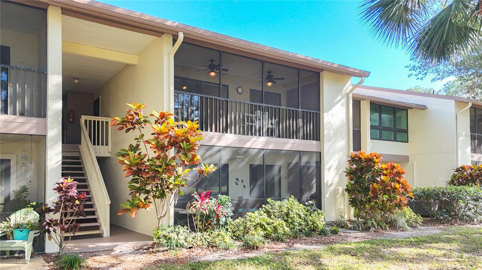 PHASE 5 BIRD BAY VILLAGE This second floor well maintained 2 bedroom 2 bath with its HIGH VAULTED CEILING creates a bright and inviting space. Unlike many units, this guest bedroom has no accordion curtain divider or french doors! You will be captivated by the incredible colors in the western sky at sunset from the 2 SCREENED LANAI'S Looking through the tree tops you have views of 2 peaceful ponds which makes this unit stand out from the rest. The main lanai spans the entire length of the living room and the guest room both with sliding doors that expands your living space. Plus your Primary bedroom has sliding doors to your own private lanai. NEW ROOF 2024. Bird Bay Village is a resort-style community with pools, tennis and pickle ball courts, fitness center, library, clubhouse and shuffleboard. There are plenty of planned activities for you to join in. Bird Bay Village has beautiful tree lined streets where you can enjoy biking and walking throughout the community. You can also explore the LEGACY TRAIL & The VENETIAN WATERWAY PARK which gives you miles of paved trails with access right at our entrance. BIRD BAY PHASE 5 HAS THE LOWEST HOA FEES in the community. The popular Island of Venice is only a few minutes away where you can enjoy quaint shops, great restaurants, entertainment, a pubic library, The Venice Performing Arts Center, our beautiful Venice public beach and a Farmers Market every Saturday to name a few. See, you can have it all.