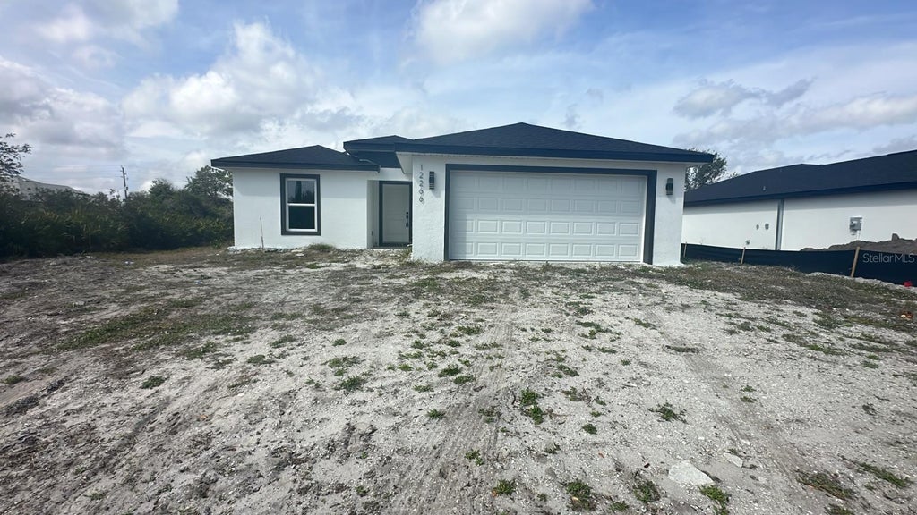 Photo of 13266 Drysdale Avenue, Port Charlotte, FL 33981 (MLS # TB8561875)