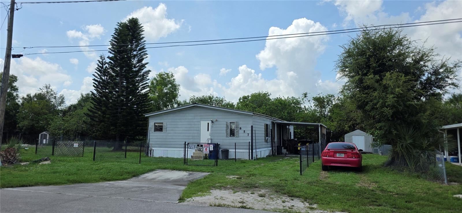 (PRICE IMPROVEMENT) INVESTORS WELCOME, 3 bedroom two bath MH, Located on a dead end street, very quiet area. Fenced in yard for pets. Metal roof, extra tie downs for hurricanes.
8ft x 10ft out building.