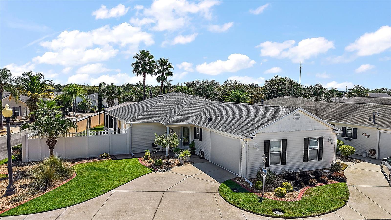 Location, Location, Location! This beautifully updated Anna Maria Courtyard Villa sits on a premium corner lot in the highly sought-after Village of Caroline—just under a mile from Lake Sumter Landing! Enjoy easy access to Restaurants, Shopping, Nightly Entertainment, the Scenic Boardwalk, and everything The Villages Lifestyle has to offer.
This 3-bedroom, 2-bath Villa is designed for both Comfort and Style. The Open Floor Plan features Vaulted Ceilings and Sliding Glass Doors from the Dining and Living areas that lead to an expansive Lanai with a large Birdcage, partially covered for shade and relaxation. Unwind in your Private SPA or consider adding a Pool—there’s room for it on this OVERSIZED LOT!
The Chef’s Kitchen shines with Granite Countertops, Wood Cabinetry with Crown Molding and Pull-outs, Stainless Steel Appliances, and a functional Island perfect for prepping and entertaining. The Living and Dining areas overlook the Park-like Courtyard, offering a peaceful, private setting.
The Primary Suite is a true Retreat, complete with a Custom Walk-in Closet and Built-ins and a luxurious En-Suite Bath featuring a Solid Surface Walk-in Shower, Dual Sinks, and matching Solid Surface Counters.
Additional highlights include:
Tile and Laminate Flooring throughout – NO CARPET!
Chair Rail with Beadboard and Plantation Shutters
New ROOF (2021)
New HVAC System (2021)
New Dishwasher, New Electric Garage Door Screen, Updated Sprinklers, New Attic Stairs and
Two Fruit-bearing Orange Trees in the private backyard.
Just minutes to the Community pool and Coconut Grove Recreation Center, this Villa combines Convenience, Comfort, and Charm in the Heart of The Villages.
Don’t miss this rare opportunity—schedule your private tour today!