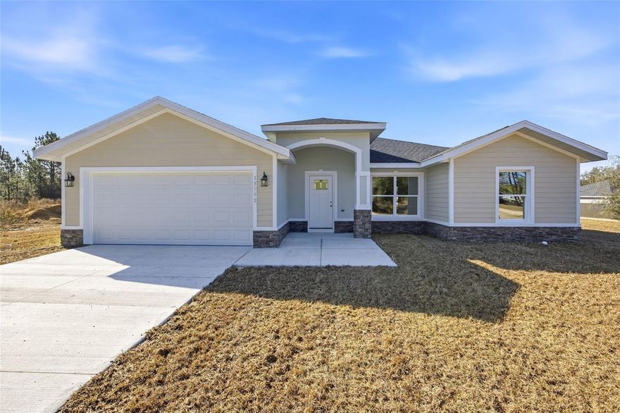 Brand new Bueso model in Rolling Ranch Estates with 1,559 sq ft of living space and 2,003 sq ft total. This 3 bedroom, 2 bath home has a split floor plan with vaulted ceilings, an open kitchen with island, stainless steel appliances, quartzite counters, and plenty of cabinet space. The master bedroom has a walk-in closet and a private bath with double sinks and a walk-in shower. The other two bedrooms are on the opposite side of the home with a full bath in between. Features include luxury vinyl plank flooring in the main areas, inside laundry, a two-car garage, and a covered front entry. Great location just minutes to Hwy 484, shopping, dining, Ocala, Dunnellon, and the Rainbow River.