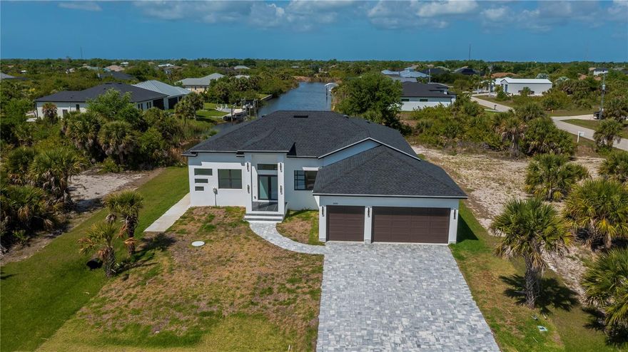 Waterfront living with direct Gulf access awaits in this spectacular custom 2025 built home nestled on a nearly half-acre double corner lot in coveted South Gulf Cove! This elegant 3-bedroom, 3.5-bath residence features an oversized 3-car garage and offers exceptional privacy surrounded by lush tropical landscaping and a striking paver driveway that leads to a soaring covered entryway—truly a boater’s paradise and tropical retreat.

Step inside to an open-concept floor plan with elegant architecture enhanced by soaring 12-foot ceilings, rich European-inspired decor including porcelain flooring, and an abundance of natural light that fills every room. The chef-inspired kitchen dazzles with quartz countertops, sleek custom cabinetry, a coordinating backsplash, decorator lighting, stainless steel appliances, a full-sized pantry, ambient lighting, a center island breakfast bar, and a separate dry bar/coffee station. This space flows seamlessly into the scenic dinette and spacious living areas, all framed by stunning long canal views perfect for enjoying refreshing cross breezes.

The executive-style office at the front of the home offers great versatility, ideal as a fourth bedroom or extra den. The master suite is a breathtaking, zen-like sanctuary featuring tranquil water vistas, bamboo flooring, a tray ceiling, an oversized walk-in closet, and a spa-inspired ensuite bath, high end imported fixtures with a luxurious walk-in shower, private water closet, and dual split vanities designed for pampering.

Guests and family will appreciate the refined second bedroom with bamboo floors, its own adjoining full bath, and endless views. The third bedroom is equally spacious with a large closet and bamboo floors, sharing a beautifully designed full bath. 

Step outside to the expansive back patio, already plumbed for an outdoor kitchen and offering ample room to add a pool, creating the perfect setting for entertaining or relaxing in paradise , boating or enjoying Floridas nature up close and personal. Inside laundry room, exceptional finishes, NO CDD and impact windows ensure extra peace of mind and exceptional value. The oversized 3-car garage provides all the space you need for your toys and storage featuring a power outlet for a generator, custom design details, and two windows to flood the space with natural light..

South Gulf Cove is a premier deed-restricted community with a voluntary HOA offering remarkably low annual dues of just $120. HOA members can enjoy access to an air-conditioned clubhouse with complimentary Wi-Fi, ping pong, darts, cornhole, horseshoes, tiki huts, and discounted clubhouse reservations. Multiple community parks nearby feature walking paths, nature trails, a boat launch, fishing docks, picnic shelters, BBQ grills, and playgrounds.

Located just minutes from world-class fishing, golf courses, shopping, dining, and Southwest Florida’s stunning beaches like Boca Grande and Manasota Key, South Gulf Cove offers access to over 55 miles of waterways leading to Charlotte Harbor, Myakka River, and the Gulf of Mexico.

This is the luxurious waterfront Florida lifestyle you’ve been dreaming of —make it yours today. Schedule your private showing now!