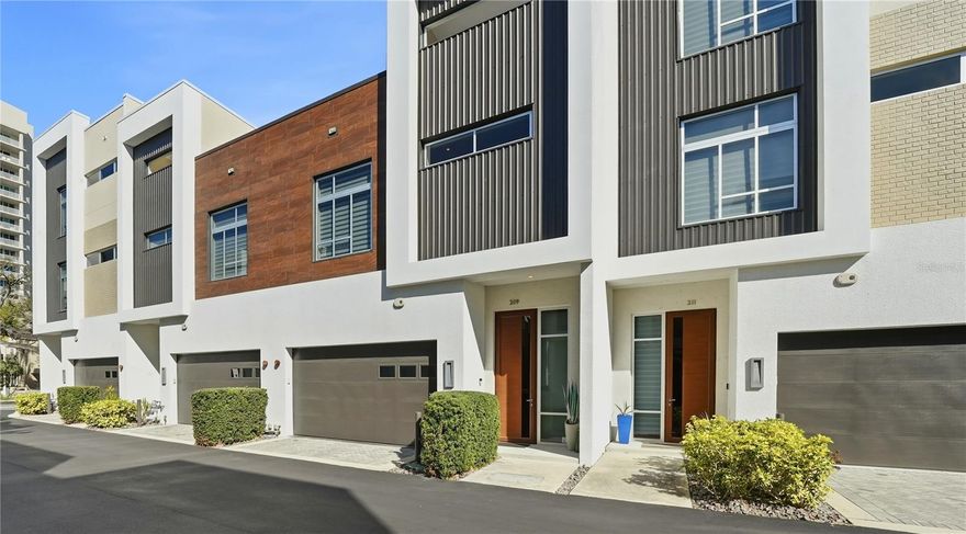 Amazing property and location! This Townhome is located between Osprey and Orange Avenues off of Ringling Blvd. in downtown Sarasota with 2 spacious bedrooms and 2.5 Baths. The Q is a unique enclave of 40 individually owned townhomes (not a condo). The moment you enter the front door, you will be mesmerized by the 13-foot-tall ceilings, the 8'-foot-tall solid wood Italian doors and a serene view through the foyer out the back door to historic Laurel Park. The downstairs area (11' x 10') is a great office space with large windows that could also work as a den. The second bedroom is conveniently located on the first floor and boasts both a walk-in closet and a double closet. This spacious second bedroom has an ensuite bathroom with a Lube single sink cabinet with quartz countertops and an oversized walk-in shower. Landry room is also, conveniently located on level one. On level 2, At the top of the stairs you are greeted by an amazing kitchen with Modern cabinets, quartz countertops and stainless-steel appliances. The glass tile backsplash and knee wall facing the living room are stylist and accessible, shimmering with light from the over-sized windows. The view from the upstairs living room and dining room is a scenic view of the treetops of historic Laurel Park. Step out onto the serene, private balcony where you feel like you're in the treetops.  All windows are impact glass.  The attached 2-car garage has spacious storage. The location is ideal. You are two blocks from the Saturday farmer's market and one block from amazing restaurants. If that's not enough, stroll to the theater, opera, or the marina. The Q is a very short ride or walk to the Legacy Trail connecting you from downtown to Venice. The free Breeze trolley runs every 30 minutes to takes you to St. Armand's Circle or out to Lido Beach. 

Buyers and/or Buyers Agent to verify all pertinent information, including room sizes, as they may be approximate. All Association information should be verified with Property Management Company or Association. Information deemed reliable but not guaranteed.