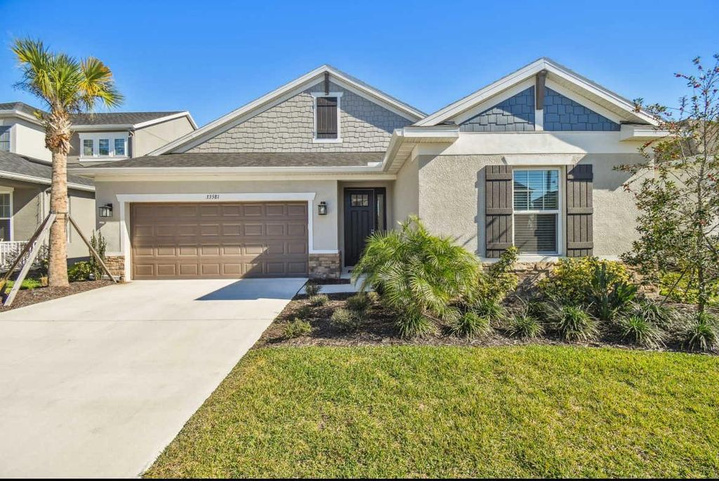 Photo of 33581 Castaway Loop, Wesley Chapel, FL 33543 (MLS # O6168769)