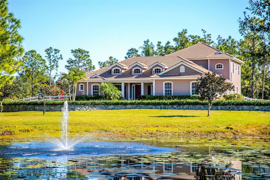 Welcome to Panther Ridge, where refined country living meets timeless elegance.
Located just outside the coveted Lakewood Ranch area, Panther Ridge is a 4,500-acre estate community offering 15 miles of hiking and equestrian trails, family parks, and true estate-sized homesites. This extraordinary custom Craftsman estate sits on 9.27 acres of high and dry land, delivering a rare blend of privacy, natural beauty, and modern luxury.
The home features 5 bedrooms, a dedicated office, and a spacious family room, providing both functionality and flexibility for today’s lifestyle. Perfectly positioned near premier shopping, dining, and medical facilities, this property is also zoned for horses and includes two state-of-the-art pickleball courts, widely regarded by many experts as among the finest on Florida’s West Coast—an exceptionally rare and exciting amenity.
A winding circular driveway welcomes you home, framed by exceptional curb appeal and a serene reflection pond that sets the stage for breathtaking sunsets. Step inside to a residence that instantly feels warm, inviting, and thoughtfully designed.
Built in 2005 and extensively upgraded, the home offers every feature today’s luxury buyer desires, including a tile roof, Generac whole-house generator, tankless water heater, updated bathrooms throughout, and a spacious laundry room with abundant cabinetry. The family room serves as the heart of the home, ideal for everyday living and entertaining alike.
Outdoor living is exceptional, highlighted by a large heated saltwater pool and spa, an outdoor kitchen, and expansive areas perfect for gatherings and relaxation. Car enthusiasts will appreciate the oversized three-car garage.
The upper level is nothing short of spectacular, featuring a large bonus room with rich wood flooring and panoramic views—ideal as a home theater, game room, or private retreat—along with two additional rooms and a fully updated bathroom, making it perfect for guests or family.
The land itself is irreplaceable. Walk the property and experience the tranquility, privacy, and natural beauty that define Panther Ridge. Though it feels worlds away, you are just minutes from everything: The Concession Golf & Country Club across the street, Lakewood Ranch Premier Sports Campus (4 miles), future Publix (5 miles), UTC Mall, Benderson Park, and top-tier dining, shopping, schools, and medical facilities.
This is more than a home—it’s a lifestyle.
Experience the peace of country living with the convenience of the city in one truly extraordinary estate.