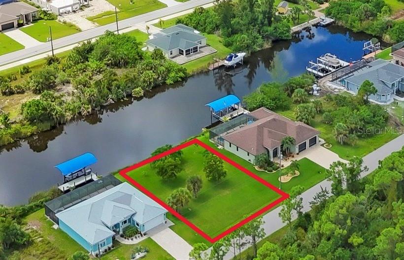 This listing is for the vacant lot only. The house next door is also available. From here you can pilot your boat through the canals and a single lock to get out to Charlotte Harbor and the Gulf of Mexico. In about ten minutes you will be in the lagoon / lake where there is no wake zone, and from there it is about twenty minutes to the lock and open water. South Gulf Cove is an ideal place to enjoy the best of Florida's outdoor living. An HOA with an optional fee provides a community center and some architectural review standards for all to follow. Taxes reflect the current bill that includes the house and lot.