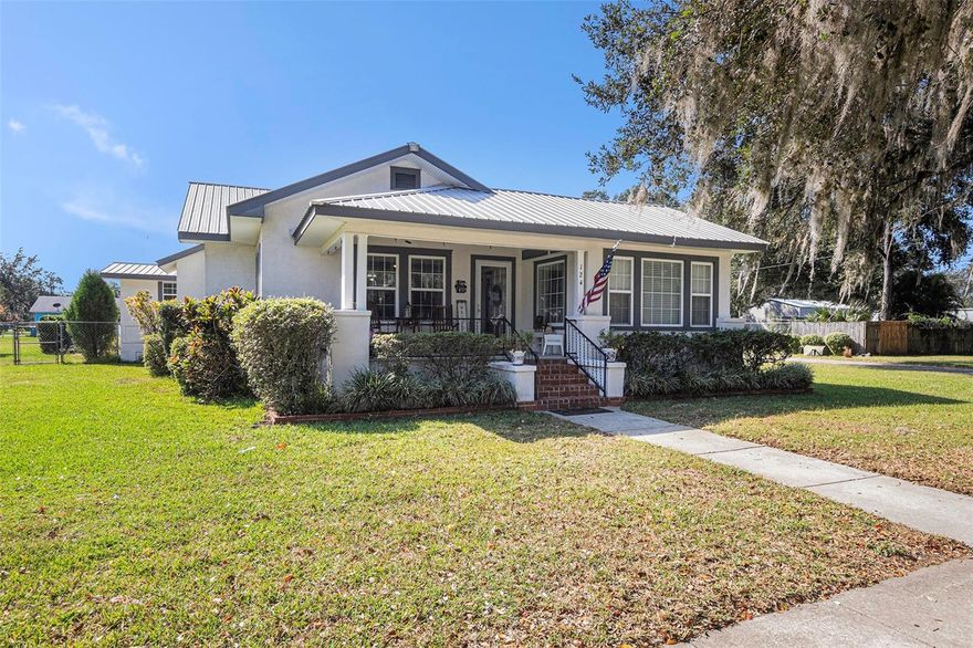 Charming 1922 Home with Expansive Lot - Largest Lot for sale in Fort Meade! Welcome to this beautifully maintained 1922 home, where classic charm meets modern comfort. Nestled on just under an acre, it boasts the largest lot available for sale in Fort Meade at the time of posting, offering plenty of space for your outdoor dreams. Key Property Upgrades: Metal roof, less than 8 years old, comes with a transferable lifetime warranty for peace of mind. Two HVAC units, also less than 8 years old. The water heater is under 2 years old. A two-car garage with electric door openers adds convenience. Enjoy the screened-in back porch/Florida room that connects to the garage, creating the perfect space for relaxing in a porch swing. A lovely rose garden area and a private garden space behind the workshop provide additional outdoor charm. The workshop, detached from the garage, boasts two garage doors, one with an electric opener, one sliding door. Additional storage is available in another shed located at the rear of the property, perfect for lawn equipment and more. A long driveway connects to the two-car garage behind the house, offering ample parking space. City water, with a Well for irrigation. Exterior Features: Classic front porch perfect for morning coffee and relaxation. A vast and private yard, offering endless possibilities for gardening, recreation, and more. Timeless appeal with all the old house charm you desire. Interior Features: Step inside to an inviting entry room that sets the tone for this historic gem. The living room is bathed in natural light, featuring glass double doors entry and large windows. A spacious great room seamlessly connects to the kitchen, with a convenient bar and bar stools, making it a hub for gathering and entertaining. The kitchen boasts vaulted ceilings, laminate countertops, tile floors, stainless appliances, and a 6-month-old MAYTAG dishwasher. A total of 3 bedrooms provide comfortable living space. Discover a versatile bonus room with a fireplace that can be an ideal office or guest bedroom. An elegant arch entryway leads to the dining area, with tile floors. Crown molding graces select rooms, adding a touch of sophistication and A pantry provides additional storage convenience. This historic Fort Meade home offers a unique blend of Antique Charm and Modern Amenities, making it a must-see for those seeking a timeless residence with ample outdoor space. Don't miss the opportunity to make this property your own!