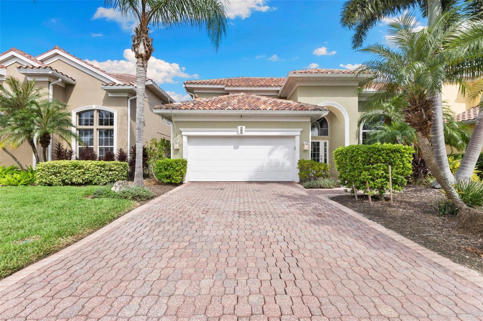 Nestled within the exclusive, gated Riviera Dunes community on the Northern Shore of the Manatee River, this contemporary masterpiece presents an unparalleled waterfront lifestyle. The residence has been meticulously reimagined through a comprehensive professional remodel where no expense was spared, resulting in a home of exceptional sophistication and light.
Upon entry, the grandeur of 20-foot ceilings and thoughtfully opened sight lines immediately captivates, creating a luminous and expansive atmosphere. The heart of the home is a stunning chef’s kitchen, appointed with sleek quartz countertops, custom cabinetry, and a suite of top-tier appliances including a built-in refrigerator and double wall oven, making it ideal for both grand-scale entertaining and intimate family gatherings.
The private owner’s suite is a serene retreat, featuring a beautifully updated, spa-inspired bath adorned with custom stonework and an generously sized walk-in closet with custom organizational systems.
Every detail has been considered, including the elegantly updated guest bathrooms which boast new vanities and exquisite custom stonework. Recognizing the needs of modern life, the home offers versatile flex spaces; a downstairs bedroom currently serves as a home office, while the upstairs loft is an exercise room, providing endless possibilities for customization.
Step outside to your private oasis with a pool and spa, the perfect venue to unwind with a glass of wine after a day spent on the water from your private 40-foot slip, complete with a 16,000 lb. boat lift. The Riviera Dunes community enhances this exceptional lifestyle with a full-service marina and a waterfront restaurant.
Perfectly positioned for convenience, this home offers easy access to the vibrant downtown areas of Bradenton and Sarasota, as well as the cultural attractions of St. Petersburg and Tampa. This is not merely a home; it is the definitive expression of modern, waterfront luxury.