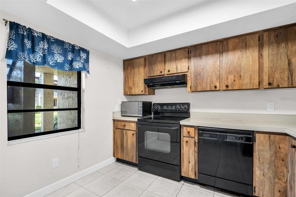 Photo of 2400 Winding Creek Boulevard #18-105, Clearwater, FL 33761 (MLS # TB8548453)