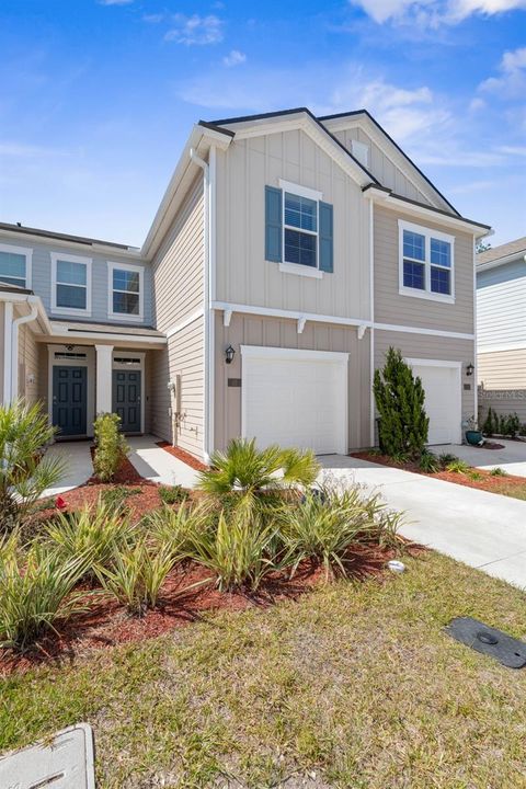 Photo of 32 Redbud Road, Palm Coast, FL 32137 (MLS # FC313400)