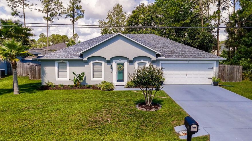 Honey, stop the car! Completely remodeled in 2020, this beautifully updated Palm Coast 4/2 block home is packed with upgrades and charm! From the moment you arrive, you’ll notice the fresh interior and exterior paint, updated landscaping, and inviting curb appeal. Inside, the home features stylish shiplap and wainscoting accents, completely updated light fixtures, and gorgeous luxury vinyl plank flooring installed in 2023. Driveway, lanai and garage have all been freshly painted with epoxy seal.  The stunning kitchen offers 36-inch solid wood cabinets, quartz countertops, and newer appliances installed in 2020, creating the perfect blend of style and functionality. Dedicated office with elegant French doors, perfect for working from home, a flex space, or quiet retreat. Major system updates provide peace of mind, including a new A/C in 2020, water heater in 2021, gutters in 2021, and a new roof in 2022. Step outside to enjoy the spacious 10x20 lanai added in 2021 overlooking the fully fenced backyard complete with a 7X7 shed, fire pit area, and plenty of room to relax or entertain. Conveniently located close to shopping, dining, schools, and the beach, this move-in ready home has it all! Seller is relocating due to job. *Seller is offering up to $5,000 towards buyer closing costs.