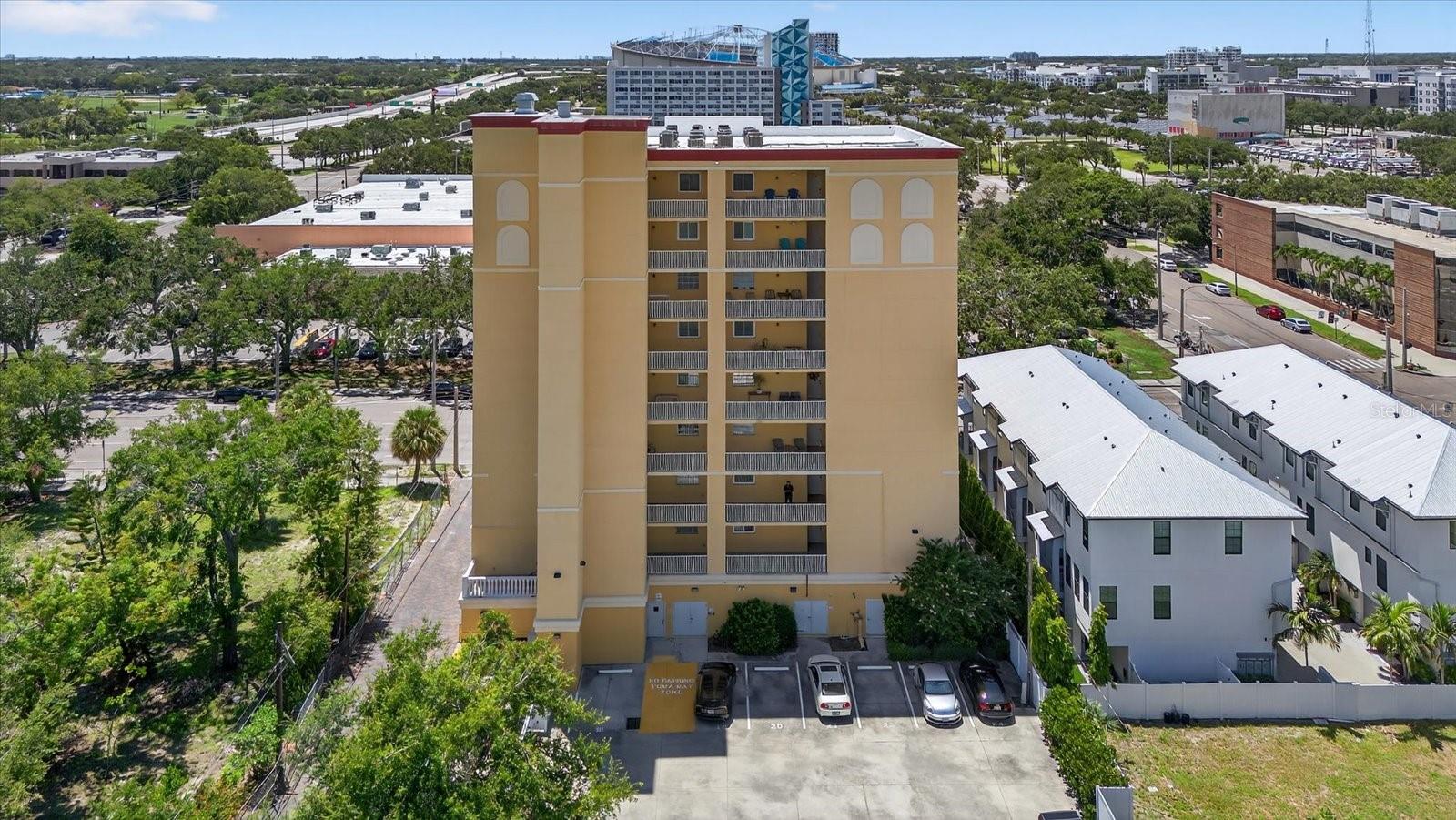 One or more photo(s) has been virtually staged. Experience vibrant downtown St. Pete living! This spacious 2-bedroom, 2-bath condo is ideally located just steps from top-rated restaurants, shopping, museums, and the beautiful waterfront. Inside, you'll find a well-designed layout featuring a generous kitchen, in-unit laundry. The primary suite easily fits a California king bed with room to spare, and includes both a walk-in closet and a second large closet for maximum storage. The guest bedroom is perfect as a dual-purpose space for sleeping and a home office, complete with another oversized closet. Step out to your private outdoor patio—perfect for enjoying beautiful sunset views. Assigned parking included. Located in the heart of downtown—this condo offers the best of city living in St. Pete!