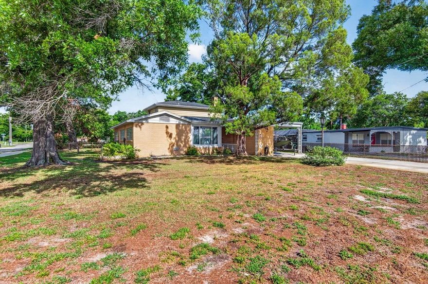 Discover the Potential in this Spacious 4 Bedroom, 2 Bath Home offering 2,072 Sq. Ft. of Living
Space and 2,863 Sq. Ft. Under Roof!
The FENCED BACKYARD includes a GREENHOUSE, STORAGE SHED, and a large
WORKSHOP complete with an AC wall unit, making it ideal for Hobbies, Projects, or
Additional Workspace!
Inside, you’ll find a generous Primary Bedroom featuring a WALK IN CLOSET and Private En
Suite Bathroom! The large family room showcases a COZY WOOD BURNING FIREPLACE,
that opens to a 15.5’ x 27’ COVERED AND SCREENED PATIO with tile flooring - perfect for
entertaining, relaxing, or hosting gatherings year-round!
Additional features include a ONE CAR CARPORT AND A SIDE YARD ACCESS GATE
FOR EXTRA PARKING! All appliances are included - even the washer and dryer! A NEW AC
that was installed in 2021 provides added comfort and peace of mind! Terrazzo flooring lies
beneath the carpet, ready to be uncovered, and restored to it’s original charm!
Situated on an OVERSIZED CORNER HOMESITE, this property offers added privacy and
room to enjoy both indoors and out!
Ideally located approximately one block from the Hillsborough River and Lowry Park, that
provides access to fishing docks, picnic pavilions, a walking trail, and a canoe and boat launch,
perfect for Florida’s outdoor lifestyle! Easy access to Downtown Tampa’s Business &
Entertainment District, Zoo Tampa, (Voted one of USA Today’s 10 Best Zoos in the Country),
Armature Works, the Riverwalk, Tampa International Airport, Professional Sporting Events,
Performing Arts, Dining, Shopping, Grocery Stores and more! NO HOA or CDD Fees! No
History of Flooding! This home offers an unbeatable combination of location, space, and
opportunity!