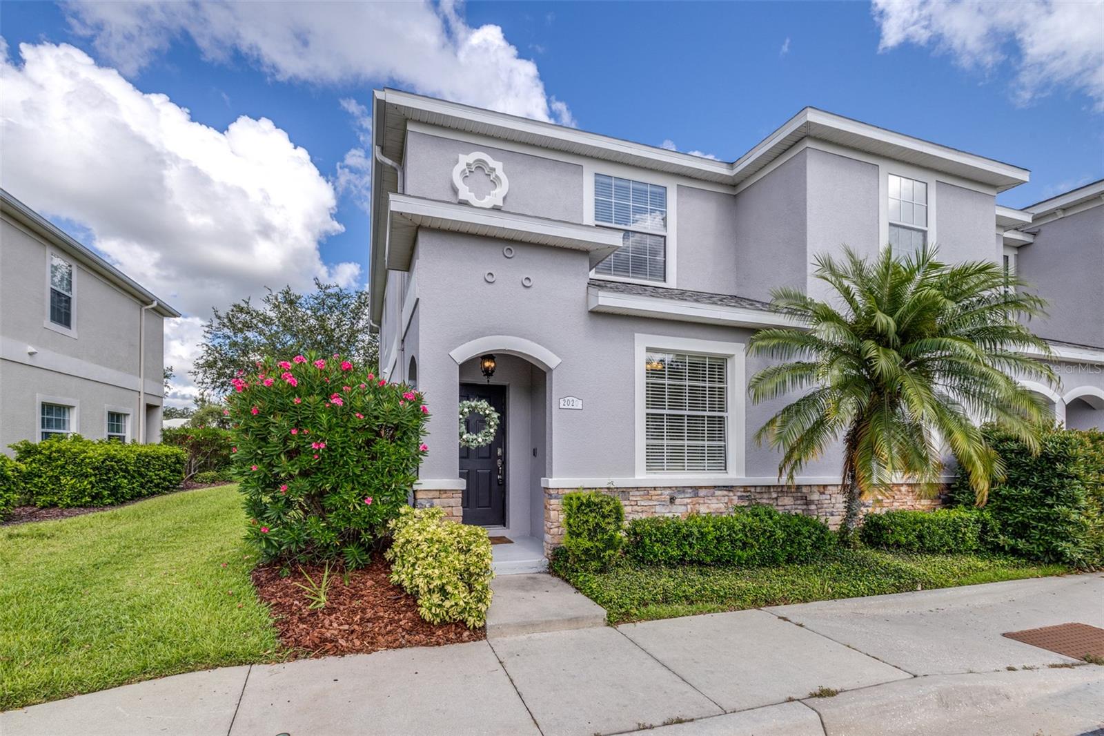 Looking for a maintenance-free home with 3 bedrooms – each with an ensuite private bathroom that comes with a home warranty? You found it! Perfect for a family or roommates, this townhome is located in an intimate, gated community tucked away, less than 5 minutes from Publix, shops, and restaurants, and just 10 minutes from I-4. A brand-new Roof, exterior paint, and HVAC system (all completed in late 2024/2025), fresh interior paint, and a keyless electronic door lock system, along with no carpet, make this a highly desirable home!
This end-unit townhome is equipped with a wired alarm system. Luxury vinyl flooring or tile is found throughout. A back patio is large enough for outdoor cooking, dining, or relaxation. A storage shed off the patio provides extra space. The kitchen features a dedicated dining area, and the family room is spacious enough for gatherings. One bedroom and bathroom are downstairs. The primary bedroom and bathroom are located upstairs, along with the oversized second master suite and bathroom. Also upstairs is a landing area large enough for a desk or table, along with a laundry space that includes a full-size washer and dryer.
This well-maintained community includes a pool, playground and recreation area at below-average HOA fees. Take a look and make this your next home!
