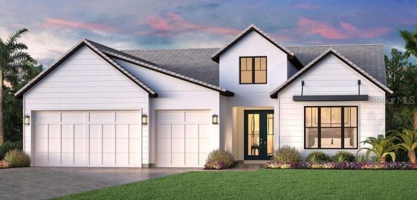 Under Construction. Expected completion October 2025. This beautifully crafted home comes with well-appointed interior finishes. The open foyer welcomes you home with stunning views of the main living space and rear yard with sunset and long lake views. The alternate covered lanai offers pristine views of the community as well as additional space under roof that is perfect for social gatherings as you enjoy the relaxing Florida lifestyle. Designer finishes in this home include upgraded Jenn-Air appliances with double oven, Kohler Sunstruck freestanding tub in the primary bathroom, and engineered hardwood floors in the main living area and all bedrooms. A wide array of community amenities will be located nearby. Discover what luxury living truly means and schedule a tour of this beautiful home.