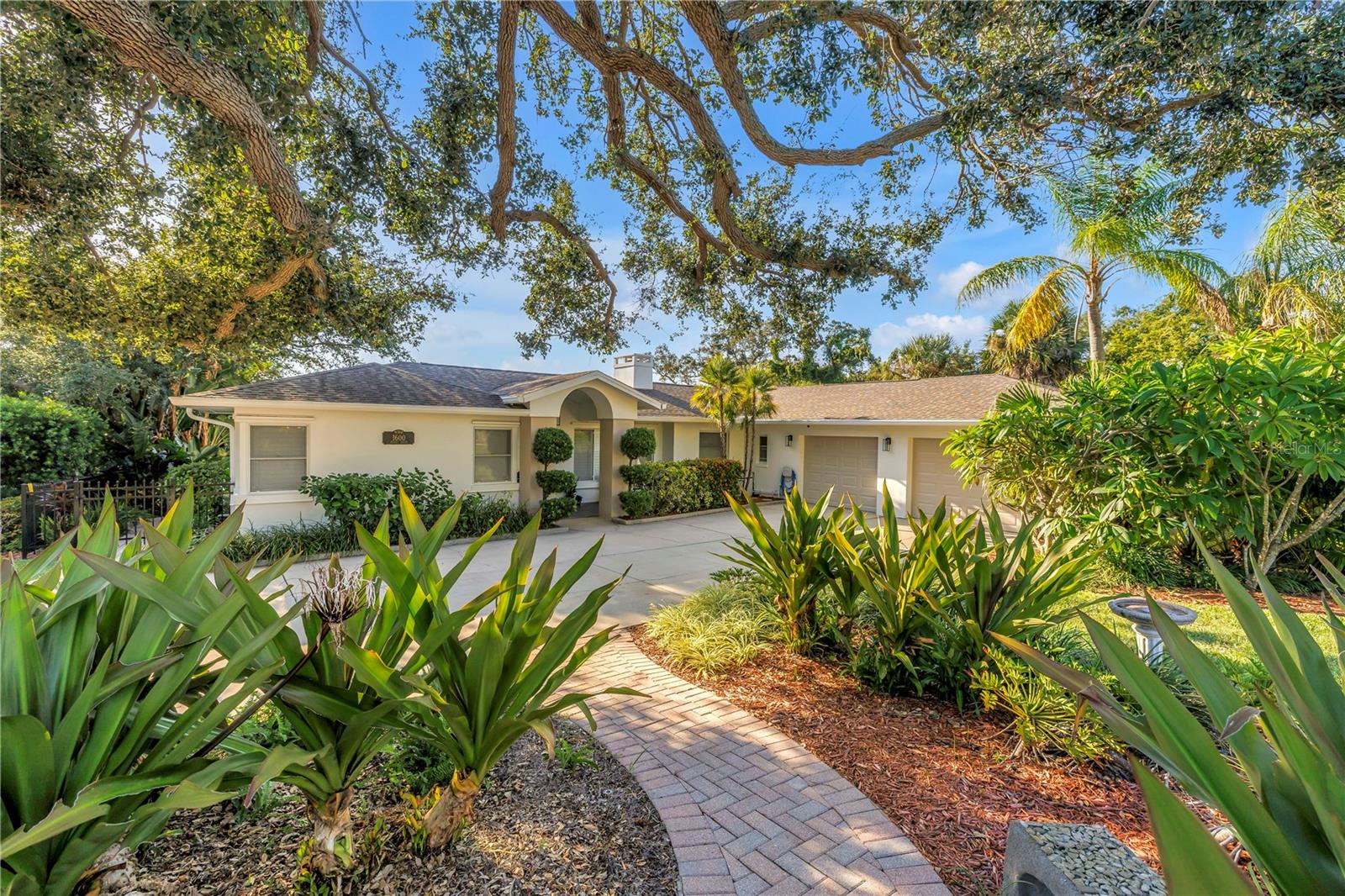 One or more photo(s) has been virtually staged. Tired of being right on top of your neighbors house? Searching for a home on elevated land but with NO STEPS to get inside the front door or anywhere else inside the house? Sounds impossible to find… Until TODAY! EMBRACE COASTAL WATERFRONT LIVING TO ITS FULLEST with this well maintained, move-in-ready, open water view paradise with the most incredible sunsets. This property is surrounded by mature landscaping on an oversized,.39 acre lot with 100ft of water frontage. Properties along Sunset Dr. on the bluff DO NOT go up for sale often. THIS HOME HAS NEVER FLOODED. It sustained NO DAMAGE from the 2024 storms. In fact, the majority of the property and house are in a non-flood zone. This home is all block construction and mostly on a crawl space. The large lot size allows room for growth if desired. The living space features a tiled fireplace, water views from every angle and new LVP floors. The kitchen is light and bright with a breakfast nook, granite counters, stainless appliances, soft close cabinets with several pull-out drawers to make the best use of space. It is conveniently accessible to the enormous covered lanai and to a utility/inside laundry room with a sink, floor to ceiling cabinets and pantry that provides an abundance of storage. There is also a natural gas line located directly behind the current electric oven if you prefer to switch to gas. The primary suite addition was completed in 1993. The dimensions for the bedroom are 16x23 not including the large walk-in closet or bath. This dreamy primary suite has stunning water views, a vaulted ceiling, access to the lanai and a large walk-in shower. The primary suite is accessed through the office, which includes built in shelving/desk, a closet and full bath. The possibilities for this space are endless and could make a fantastic mother-in-law suite! The second and third bedrooms are both good size and on opposite side of the house. The updated, main guest bath has access to the exterior pool deck. The backyard oasis features a large, covered lanai with beautiful beams and a cathedral ceiling. The Pebble Tec surface, salt water pool has a built in spa that is heated with natural gas. Imagine the breeze off the open view of Clearwater Harbor. The long dock with rope railing and Trex decking feels like it came out of a story book. At the end, enjoy the large built in Trex bench for seating while watching the sunset. It’s an ideal spot for winding down at the end of the day to watch the sailboats, dolphins, manatees, seabirds and even fireworks during holidays. The dock was built in 2017 and includes a 9000 LB Hi Tide lift that provides easy access to the intercoastal waterway, Caladesi and Honeymoon Islands and the Gulf. OTHER: Transferable flood policy ONLY $1315 a year! Roof(2012), 2 Trane AC systems-regularly maintained since owned (2014), garage doors, some windows and 2 sliders updated to impact resistant (2023), exterior paint and light fixtures (2025). This prime location has NO HOA and has easy access to the Pinellas trail, Coachman Park/Baycare Sound and more. It is set between the quaint town of Dunedin, Downtown Clearwater/ Clearwater Beach making this home just minutes from an array of restaurants, nightlife, shopping and beaches. Call today to schedule a viewing and make everyday feel like a DREAM COME TRUE... AT HOME.