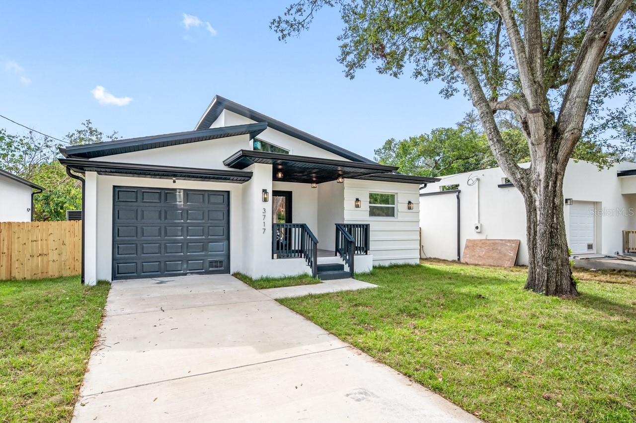 This modern single-family home, built in 2022, features 3 bedrooms and 2 bathrooms within 1,611 square feet of living space. The open floor plan includes vaulted ceilings with skylights, providing abundant natural light. The chef's kitchen is equipped with stainless steel appliances, quartz countertops, and an oversized island. Additional amenities include an indoor laundry room, a one-car garage, and two covered porches. The property is conveniently located within a short distance to the upcoming Hanna City Center and is approximately 15 minutes from downtown Tampa.