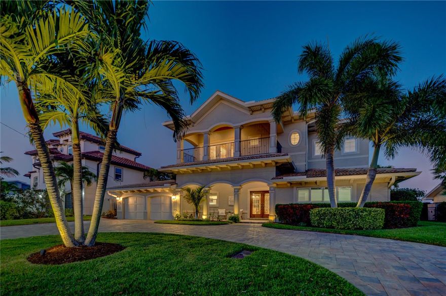 A masterful achievement of concept and design, this stunning custom built 2,878 square foot 2-story on grade WATERFRONT fenced residence showcases exquisite craftsmanship & cutting edge design. Seamlessly integrated indoor/outdoor spaces with a front covered 2nd floor master balcony which affords gorgeous rooftop sunsets over the Gulf of Mexico, 81' of waterfront, private dock with 20,000 lb. Deco Power Lift Inc lift & an additional skiff lift, fish cleaning station, saltwater Hayward heat pump heated pool, lighted pergola with paver patio perfect for entertaining! Illuminated by natural light the great room with its 13' coffered ceilings, crown molding, windows galore, remote shades, 24" x 24" tile floors is open to the dining room & kitchen. Culinary kitchen: stainless appliances, double ovens, marbled quartz tops, mosaic sea glass backsplash, white stacked cabinets, platinum pulls, center island 6-burner gas cooktop, low bar ideal for afternoon snacks with additional cabinet storage, 2-pendant lights. Credenza. 2nd-floor master suite overlooks the Waterfront, coffered ceiling, fan, Brazilian hardwood floor, 2-covered balconies with glass French door access: sunrise & sunset, v-groove ceilings, wrought iron railings. His/her custom finished walk-in closet 14' x 11'. Sumptuous master bath, his & her vanities, granite tops, maple cabinetry, glass block walk-in shower, H20 closet. Adjacent 5th bedroom a perfect den/office/study or nursery: closet, hard wood floors, plantation shutters & crown molding. 1st floor master suite: 2x glass sliders open onto the pool/patio overlooks the salt water canal, wall closet, fan & carpet. Bath en-suite, glass door shower, subway tile, white vanity, tile floor. The secondary bedrooms have plantation shutters, fans, carpet, closets. Additional guest bath 2-sink vanity, granite top, tub/shower. Professionally landscaped, sprinkler, 2-car garage, epoxy finished, paver circular driveway, Generac generator, natural gas Rinnai tankless hot water heater. Dunedin boasts both Honeymoon and Calesdesi Islands activities such as windsurfing, sailing, kayaking, Pinellas county trail, paddle boarding, fishing, jet skiing or relaxing on our sugary fine sand, not to mention craft breweries, restaurants, fine dining, ice cream and golf cart friendly!