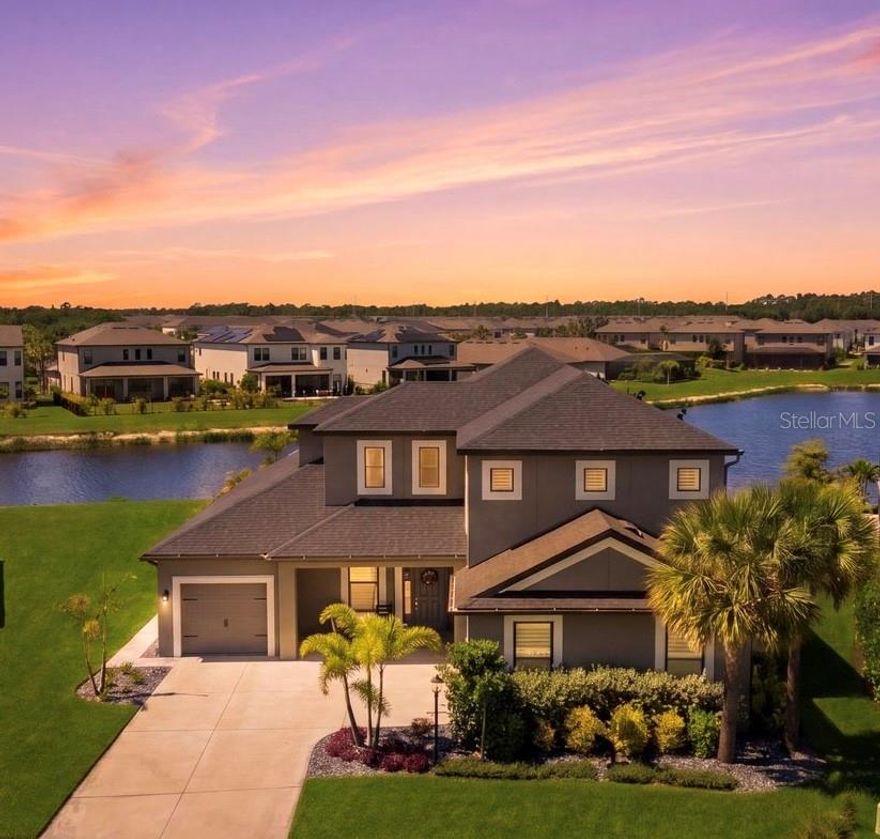 Located in Cassia at Skye Ranch, this 2023-built 5 bedroom, 4.5 bathroom 3-car garage home offers 3,519 sq ft with a first-floor primary suite on an oversized pie-shaped lot with wide lake views.

Open-concept layout with a spacious great room featuring a custom fireplace wall, wood beam ceiling detail, tray ceilings, and crown molding. Pocket sliding glass doors open fully to the lanai for seamless indoor-outdoor living.

Kitchen includes gas cooking, oversized island, quartz countertops, white cabinetry, stainless appliances, and ample seating.

First-floor primary suite with wood beam ceiling detail, massive walk-in closet, dual vanities, soaking tub, and separate shower. Upstairs offers additional bedrooms, en-suite baths, and flexible living space.

Screened lanai with saltwater heated pool and spa, upgraded panoramic screen enclosure, and extended paver walkway to the backyard with private lake views.

Additional features include a custom built drop zone, plantation shutters, front porch, ceiling fans throughout, upgraded landscaping, large laundry room, and a 3-car garage with ample storage.

Residents of Skye Ranch enjoy access to The Hub, a resort-style amenity center featuring a clubhouse, resort pool, lap pool, splash pad, kiddie pool, fitness center, movement studio, indoor basketball court, rock climbing wall, and social spaces including a café, demonstration kitchen, and game room. Outdoor amenities include pickleball, tennis, bocce ball, sand volleyball, and over 25 miles of trails and parks. Turner Park offers additional soccer and baseball fields, playgrounds, and open space. A K-8 school is located within the community.

Future amenities include The Cove, planned to feature a lazy river, resort pool, and waterslide.

Conveniently located just minutes to Waterside Place, UTC shopping and dining, downtown Sarasota, and Siesta Key beaches, with easy access to major roadways.