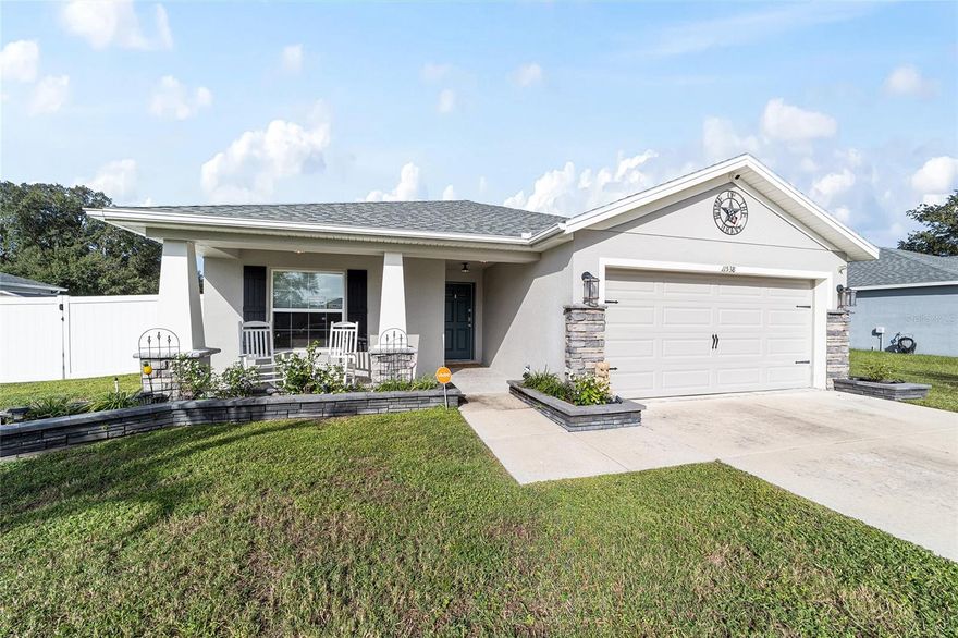 Perfectly situated in the sought-after Forest Glen community off the Hwy 200 corridor, this beautifully maintained 4-bedroom, 2-bath home offers 1,710 sq. ft. of comfortable living space. From the welcoming front patio, step inside to an open-concept layout featuring luxury vinyl plank flooring throughout the main living areas and soaring cathedral ceilings that create a bright, airy feel.
The eat-in kitchen is a chef’s delight with rich dark wood cabinetry, granite countertops, stainless steel appliances, a breakfast bar, and a spacious prep island — ideal for both everyday meals and entertaining. The oversized indoor laundry room includes granite folding counters and abundant cabinet space for maximum convenience.  The primary suite provides a relaxing retreat with dual vanities, a soaking tub, a tiled walk-in shower, and generous walk-in closets. Enjoy Florida living at its best from the screened-in back patio overlooking the expansive, nearly half-acre backyard — fully enclosed with vinyl privacy fencing.  A large detached storage building with overhead doors offers plenty of space for tools, toys, or a workshop. Conveniently located just minutes from shopping, dining, and medical facilities, and a short drive to the world-renowned World Equestrian Center, this home combines comfort, function, and an unbeatable location.