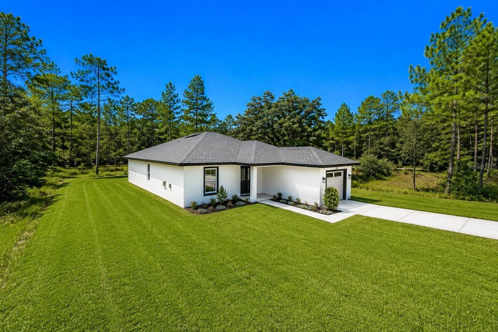 Photo of 12151 Sora Avenue, Brooksville, FL 34614 (MLS # TB8542940)