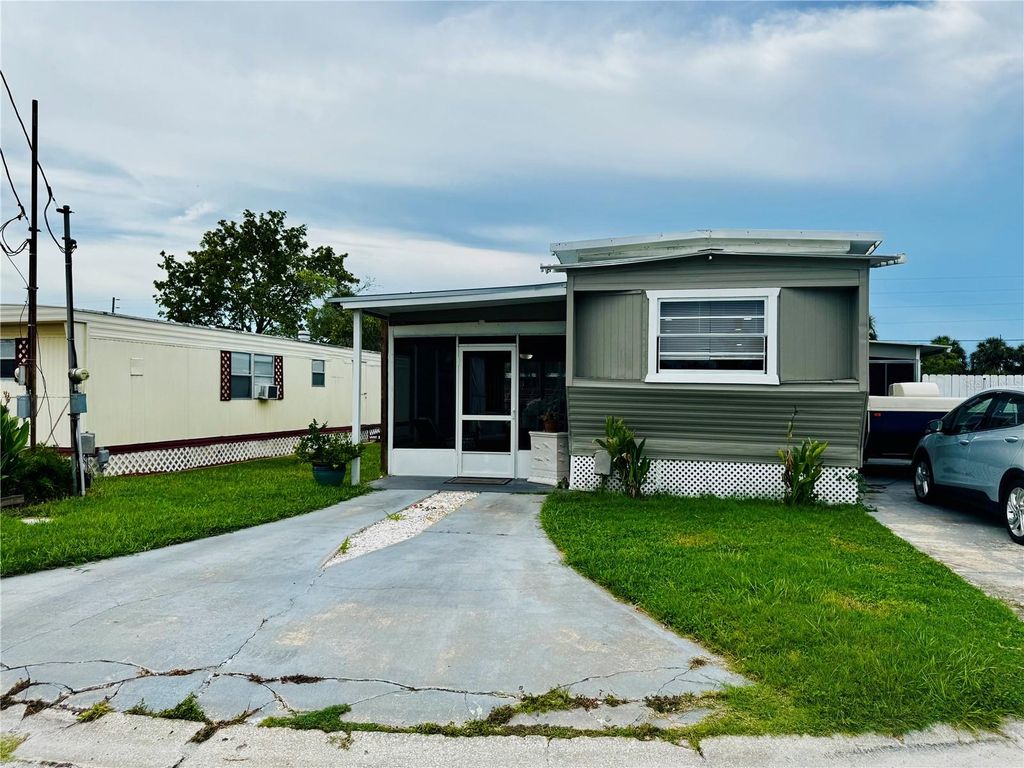 Photo of 6905 Signal Cove Drive, Hudson, FL 34667 (MLS # TB8418628)