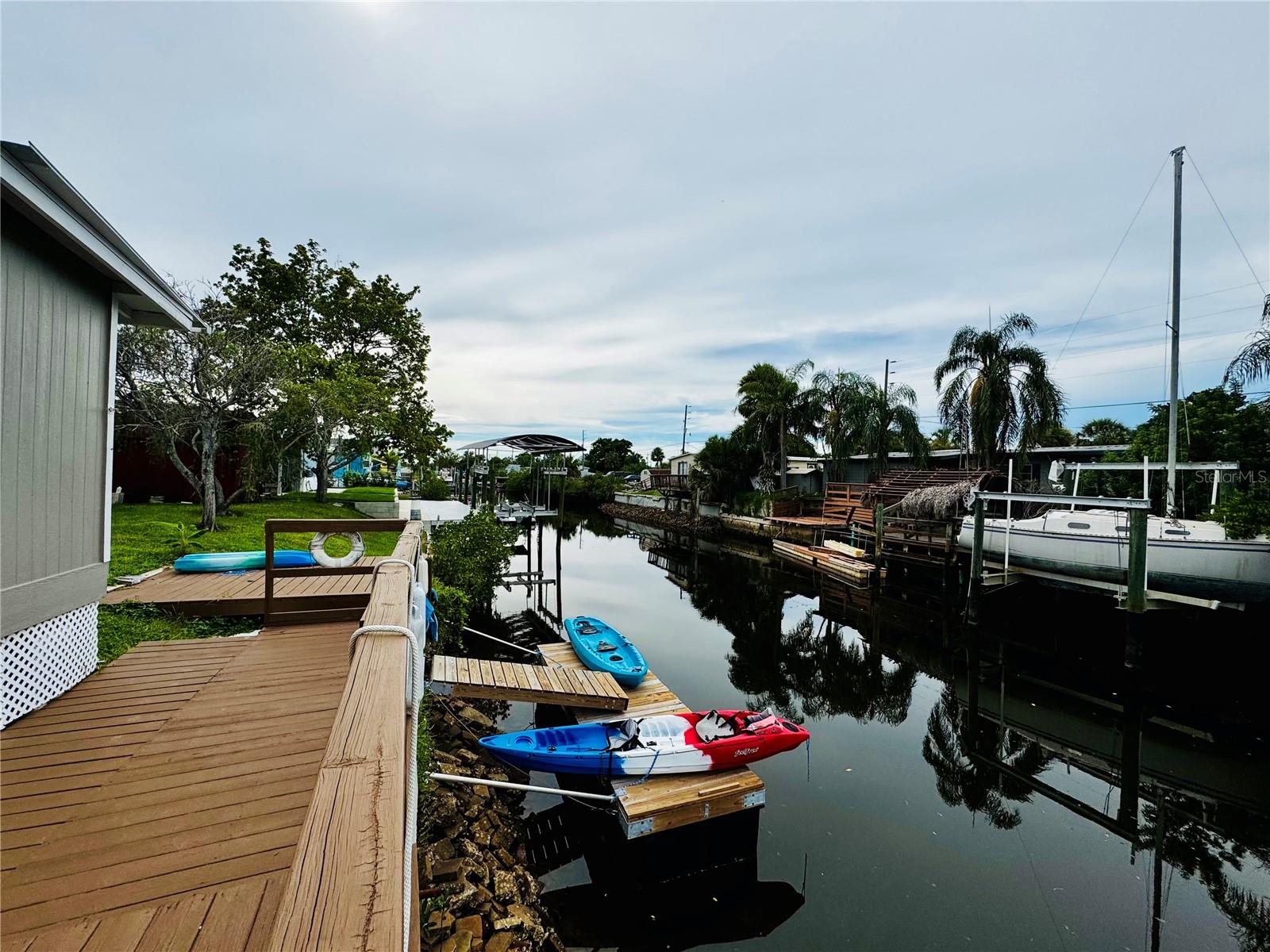 Waterfront Living with Gulf Access – 2BR/1.5BA Home + Furnished, Boat & Kayaks Included!
Welcome to your waterfront retreat! This charming 2 bedroom, 1.5 bath home on a spacious corner lot sits on a peaceful canal with direct access to the Gulf, perfect for boating, fishing, and kayaking.
The property is located in an optional HOA community offering fantastic amenities, including a clubhouse, shuffleboard courts, and a private boat ramp.
Whether you’re looking for a full-time residence, vacation getaway, or investment property, this home checks every box. With optional furnishings, waterfront access, and community perks, it’s the perfect blend of relaxation and convenience.
Don’t miss this opportunity for affordable waterfront living with all the extras included!
