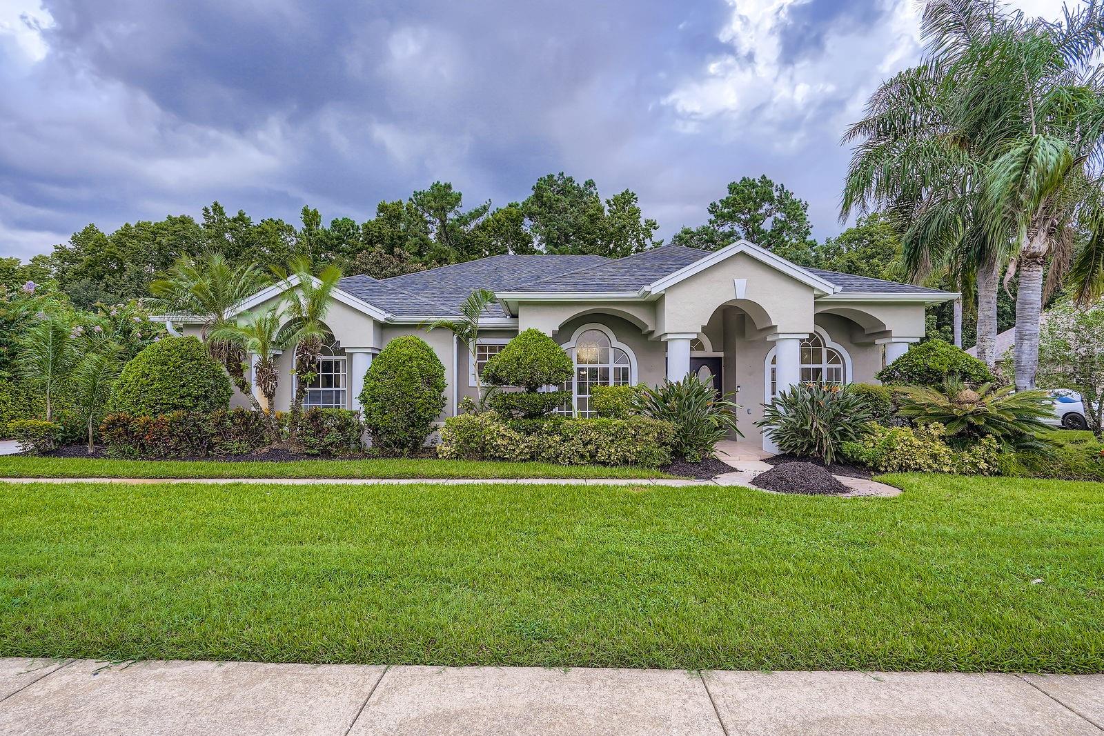 Discover comfort, space, and serenity in this beautiful one-level 4-bedroom, 2.5-bathroom home, perfectly designed for both everyday living and entertaining. Tucked away in a peaceful setting, the home features a screened-in private pool with a tranquil wooded view, creating your own backyard retreat. Inside, you'll find a bright and airy layout with high ceilings and an ideal mix of formal and casual spaces—including a living room, den, dining room, breakfast room, and a welcoming foyer. The open flow and abundant natural light enhance the home's warm and inviting atmosphere. The spacious owner’s suite offers a relaxing escape, while the secondary bathroom includes exterior access to the pool, making outdoor entertaining easy and convenient. Whether you're hosting guests or enjoying a quiet evening at home, this thoughtfully designed property checks every box. Schedule your showing today and experience the lifestyle this home has to offer!