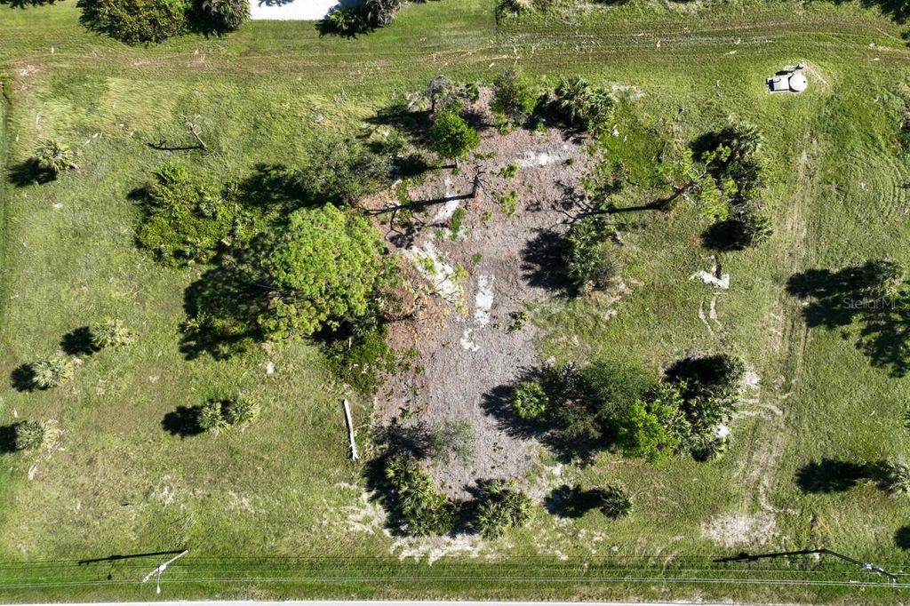 Photo of 837 Boundary Boulevard, Rotonda West, FL 33947 (MLS # D6138723)