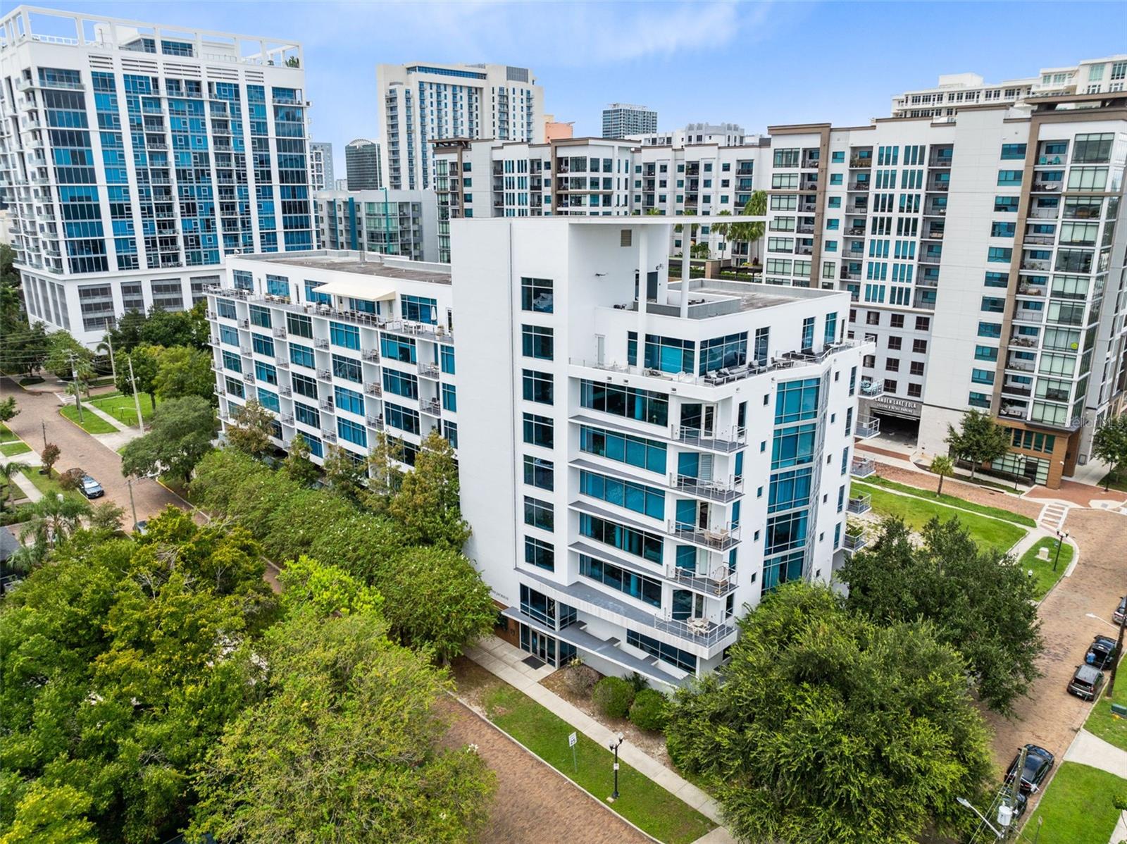 Welcome to The Jackson, one of Thornton Park’s most sought-after addresses! Perched on the 6th floor, this spacious 3-bedroom, 2-bathroom corner unit offers 1,884 sq. ft. of modern, industrial-inspired living with soaring 10-ft concrete ceilings, floor-to-ceiling windows in the living room and primary suite, and a unique floorplan full of character. The home could use a little TLC to truly shine, but the potential is undeniable. Residents of The Jackson enjoy secured 24/7 access control, two assigned parking spaces, and a fitness center, while being just three blocks from Lake Eola and directly across from Constitution Green Park, perfect for pets and outdoor relaxation. From this prime downtown location, you’re minutes to Thornton Park dining, yoga and fitness studios, parks, bike trails, Mills50, The Milk District, SoDo, Amway Center, Orlando City Stadium, SunRail, and more—making this a rare opportunity to own a corner-unit gem in the heart of Orlando.
