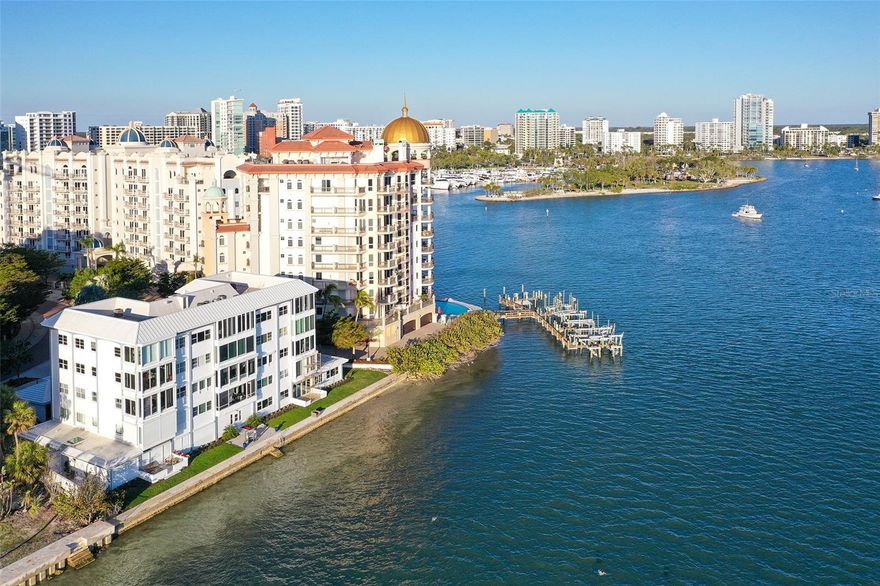 Experience Exquisite living at Harbor House South, where every moment is framed by breathtaking 180-degree Southerly views across Sarasota Bay. This stunning 3rd-floor, 2-bedroom, 2-bath end unit offers an expansive array of windows, the large one incorporates a cozy window seat that invites you to savor ever-changing vistas of the bay.

From the privacy of your home, witness marine wildlife, yachts, and sailboats gliding by, all while enjoying the stunning daily show of sunrises and sunsets. Elegant and thoughtfully designed, this home boasts high-end finishes including porcelain tile, crown molding, plantation shutters, solid core doors, and spa-inspired bathrooms.

Ideal for both entertaining and relaxation, the open and well-appointed floor plan features a spacious living and dining area, as well as a built-in office perfectly positioned to face the water. The chef's kitchen is a culinary dream with soft-close wood cabinets, quartz countertops, a state-of-the-art induction cooktop with stainless steel hood, a built-in convection oven, microwave, and a striking counter-to-ceiling glass-tiled accent wall.

Perfectly situated near Marina Jack, the Ringling Bridge, and Downtown Sarasota, this private oasis is just minutes from everything Sarasota has available. Discover the perfect blend of luxury, privacy, and convenience. Add this exceptional residence to your must-have list today!