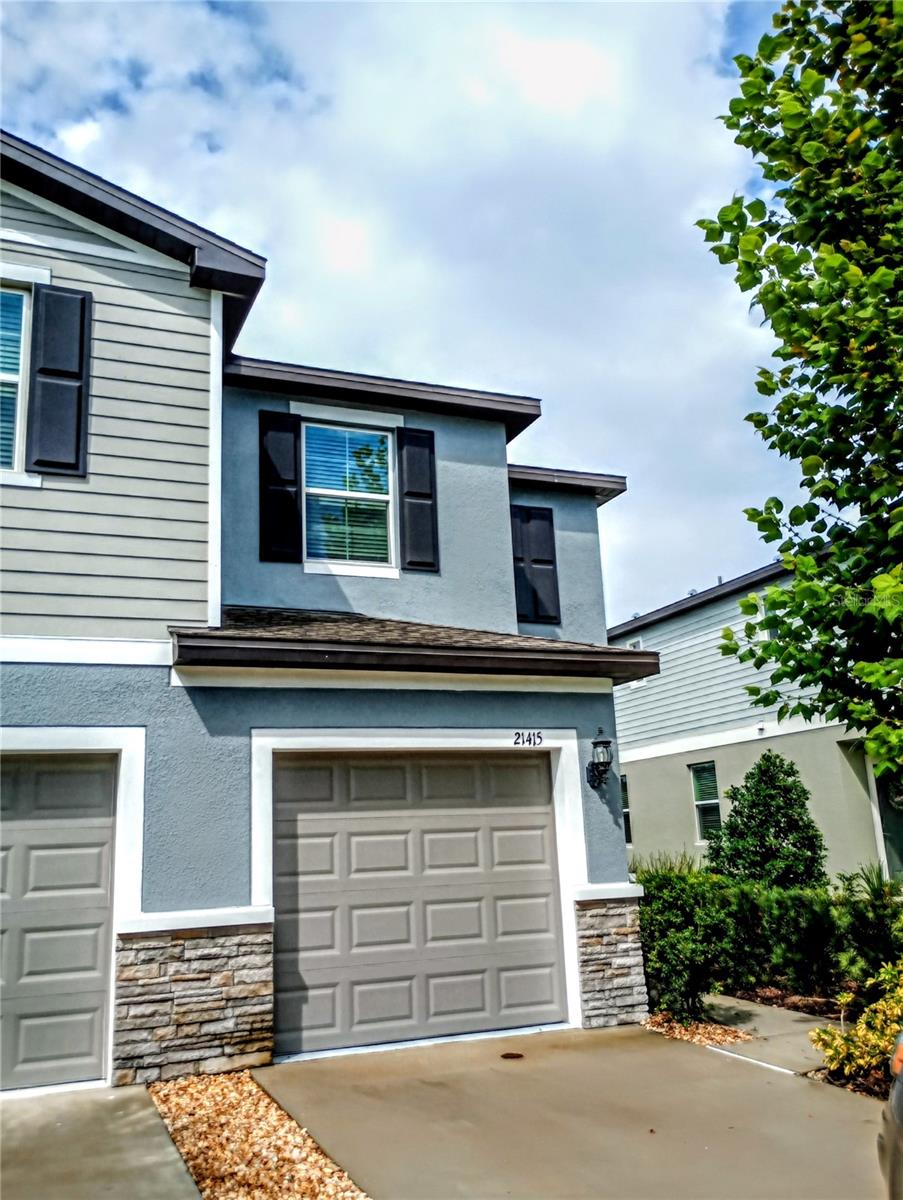 This beautiful former Model Home has never been lived in and is also an end unit featuring a water view of the pond. This townhome built in 2023 is located in the gated community of The Townes at Lake Thomas. This stunning townhome home features 2 BEDROOMS, 2.5 BATHS, and a 1-CAR GARAGE.
The first-floor entry offers a brightly lit open concept floor plan. The Kitchen features elegant granite countertops with brilliant, light cabinetry offset by new stainless-steel appliances. The Breakfast nook, directly off the kitchen features ample room for dining. There are also large sliding glass doors that lead to the expansive back patio with pond views. There is a convenient half bath downstairs off the living room that completes the main level. Garage access in also conveniently located from the interior of the unit.
Upstairs, the spacious primary suite includes a bathroom with double vanities, and a walk-in shower. The large walk-in closet has ample space for two, and the bedroom is expansive with room for a reading nook.
Just down the hall between the 2 bedrooms is a loft area that can be used as a play area or small office space. In addition, the upstairs laundry room is an added convenience located between the bedrooms.
The second bedroom with private full bath and large walk-in closet completes the upper level.
This townhome is situated conveniently close to shopping and restaurants, the Tampa Premium Outlets, as well as Advent Health, and the Land O’ Lakes Recreation Complex. The community includes a beautiful pool!
Contact us today to tour this lovely Townhome before it's gone!
