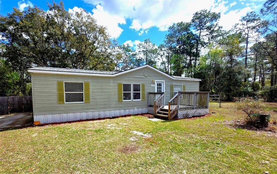 Opportunity knocks in Homosassa! This 3-bedroom, 2-bath manufactured home sits on a spacious 0.51-acre lot, offering just under 1,300 square feet of comfortable living space and the freedom that comes with having room to spread out. Built in 1997 and featuring durable vinyl siding and a roof replaced within the last 5 years, the home provides a solid foundation whether you're looking for a primary residence, winter retreat, or investment opportunity. Step outside and enjoy the lifestyle this property offers. The fully fenced backyard creates a private setting perfect for pets, gatherings, or simply enjoying the Florida sunshine. The outdoor space truly shines with a covered cooking area featuring a custom grill and pizza oven, located right beside your fire pit, making it the perfect setup for weekend cookouts, pizza nights, and relaxing evenings under the stars. Conveniently located near shopping, dining, and the incredible natural attractions that make Homosassa famous—including crystal-clear springs, scenic rivers, and quick access to the Gulf—this property delivers both value and lifestyle. Whether you're an investor, seasonal resident, or buyer looking for affordable Florida living with land, this one is worth a look.