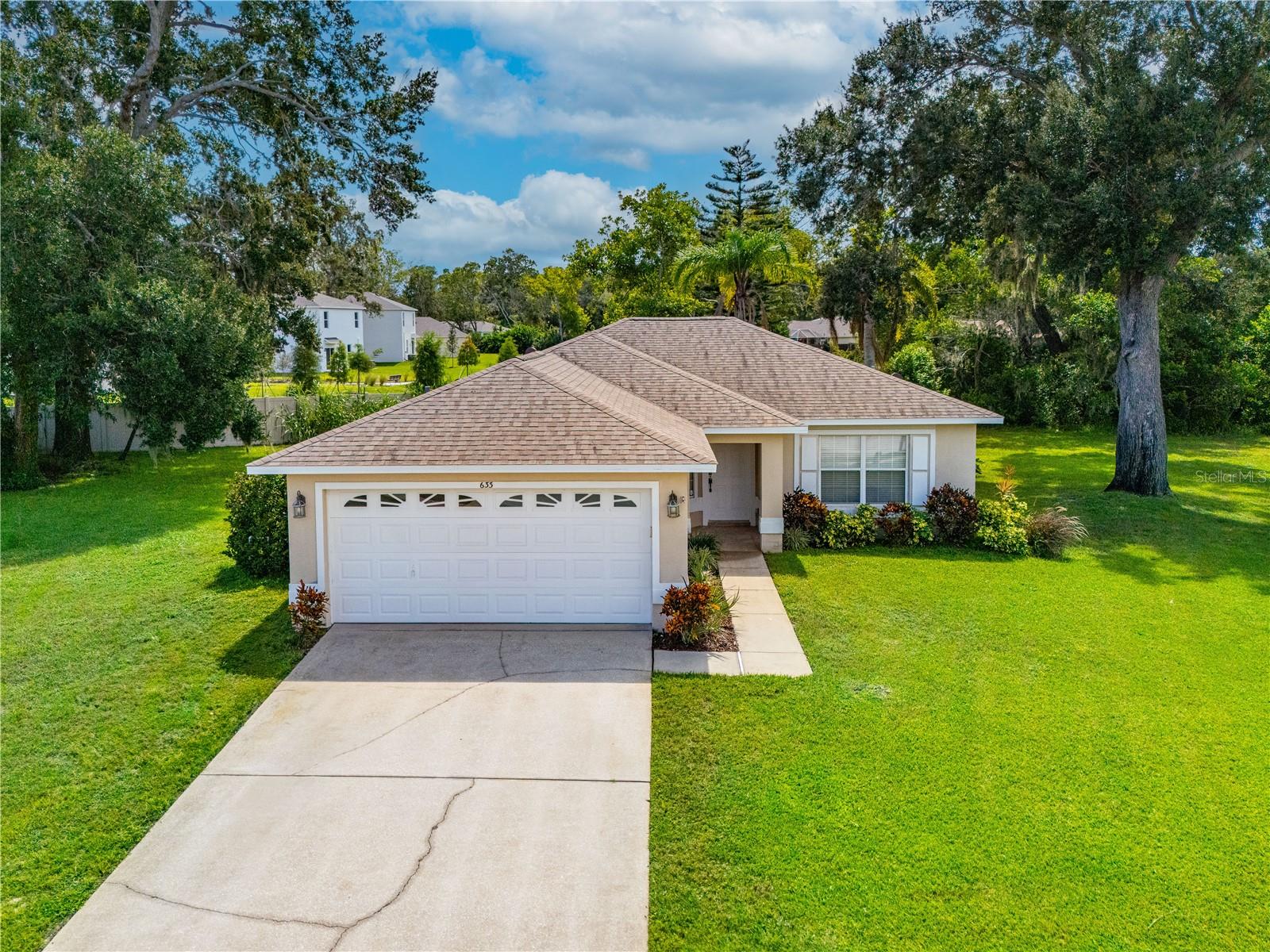 Welcome to this charming 3 bed, 2 bath ranch style home on a cul de sac at the back of Coventry Forest! This property boasts a 2020 roof and has remained HIGH & DRY during the major rain events of the past few years. The covered entry opens to the kitchen, great room and primary suite on the left, guest bedrooms and bath to the right. The split plan accommodates both time together and privacy at the end of the day. Enjoy a peaceful cup of coffee as you walk through the sliding glass doors onto your covered, screened lanai for bug-free relaxation. The separate well for irrigation ensures lush, green surroundings. Conveniently located between Beville and Dunlawton Roads, Ridgewood and Nova. Come see this little slice of paradise offered at a very attractive price!